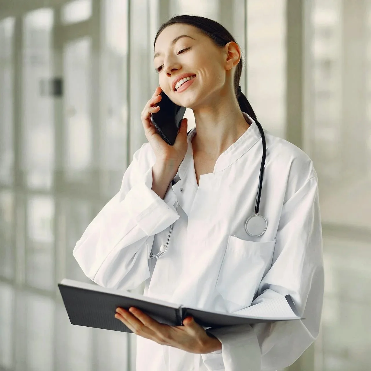 Healthcare practitioner on phone representing naturopathy and nutritional support for ADHD and autism