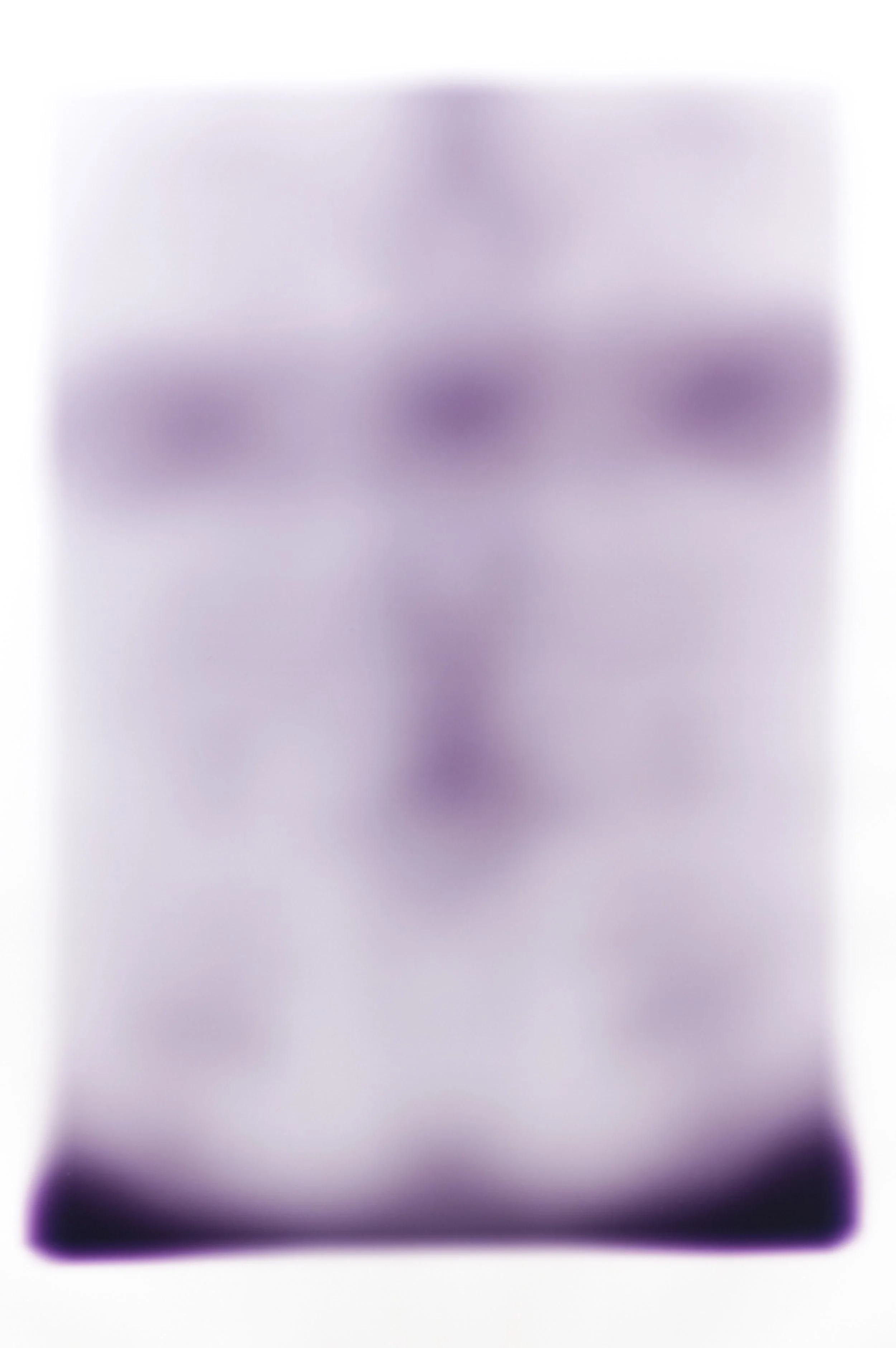 Blurred purple and white abstract background with no clear objects or subjects.