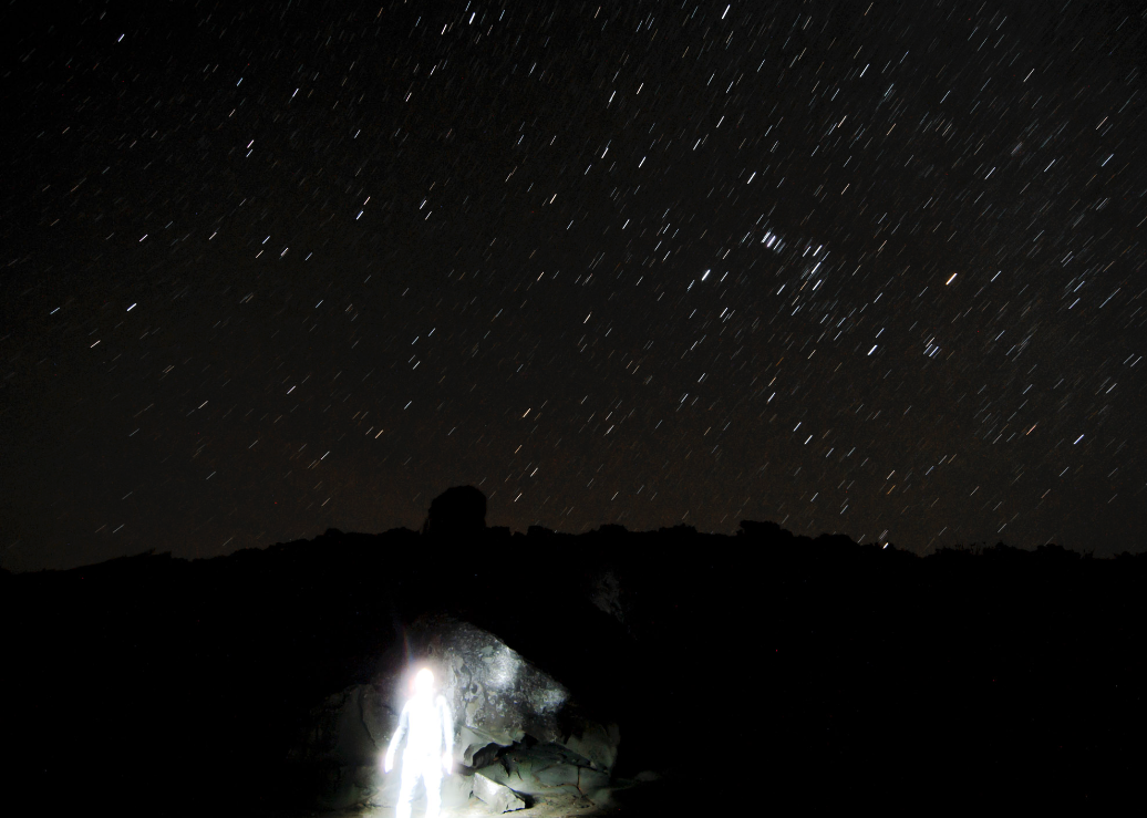 Christian Pearson - self portrait under stars whilst standing in a cave