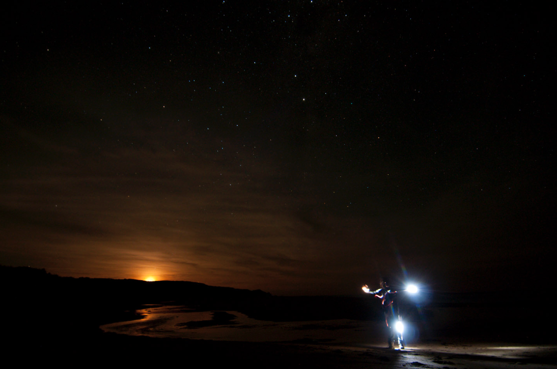 a long exposure self portrait using a torch and a tripod whilst the stars illuminate the sky