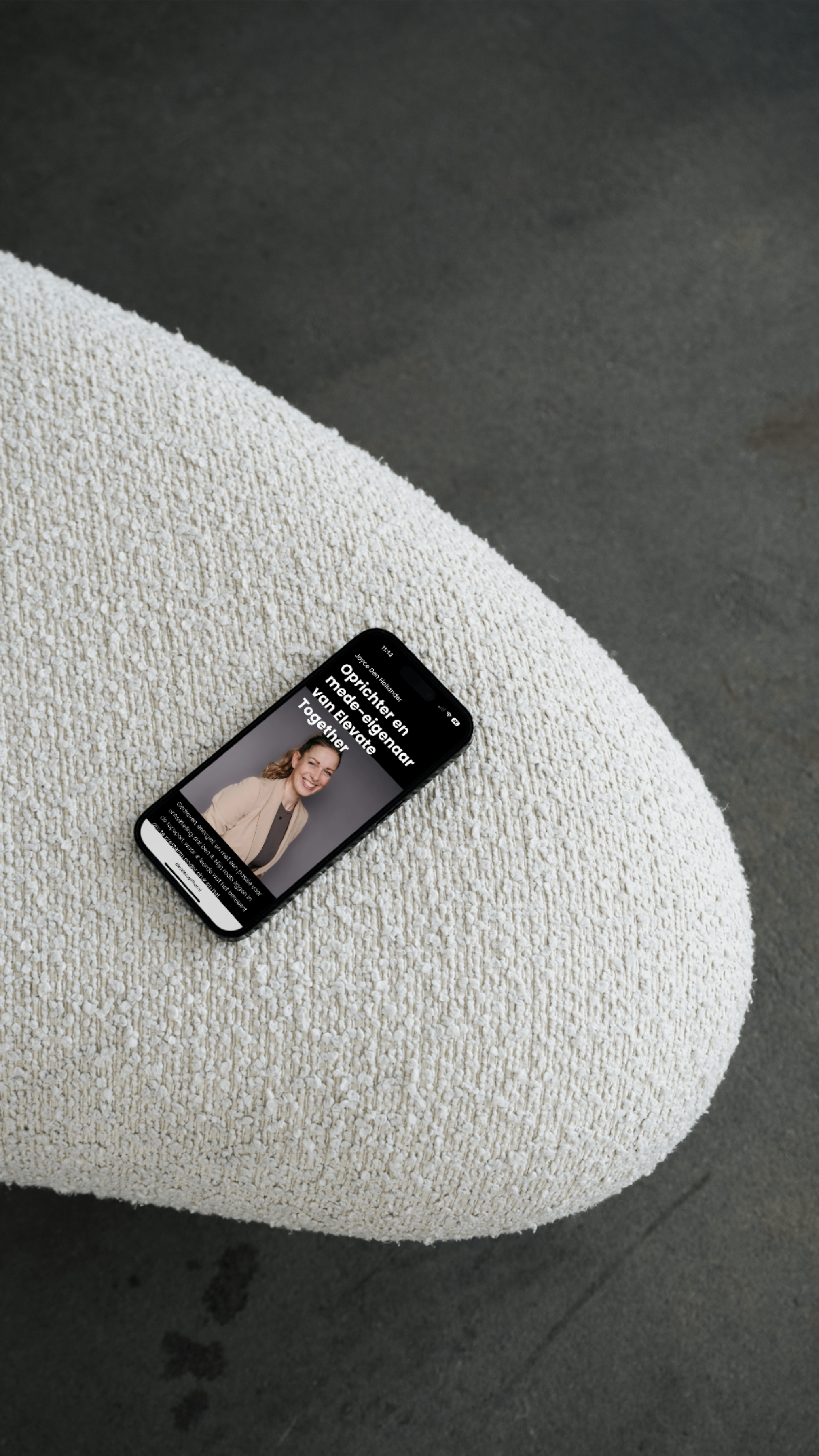 Kela creative mockup Elevate iphone on sofa.png
