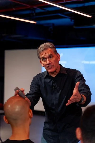 Tom Purvis delivering a seminar in Dubai in 2024