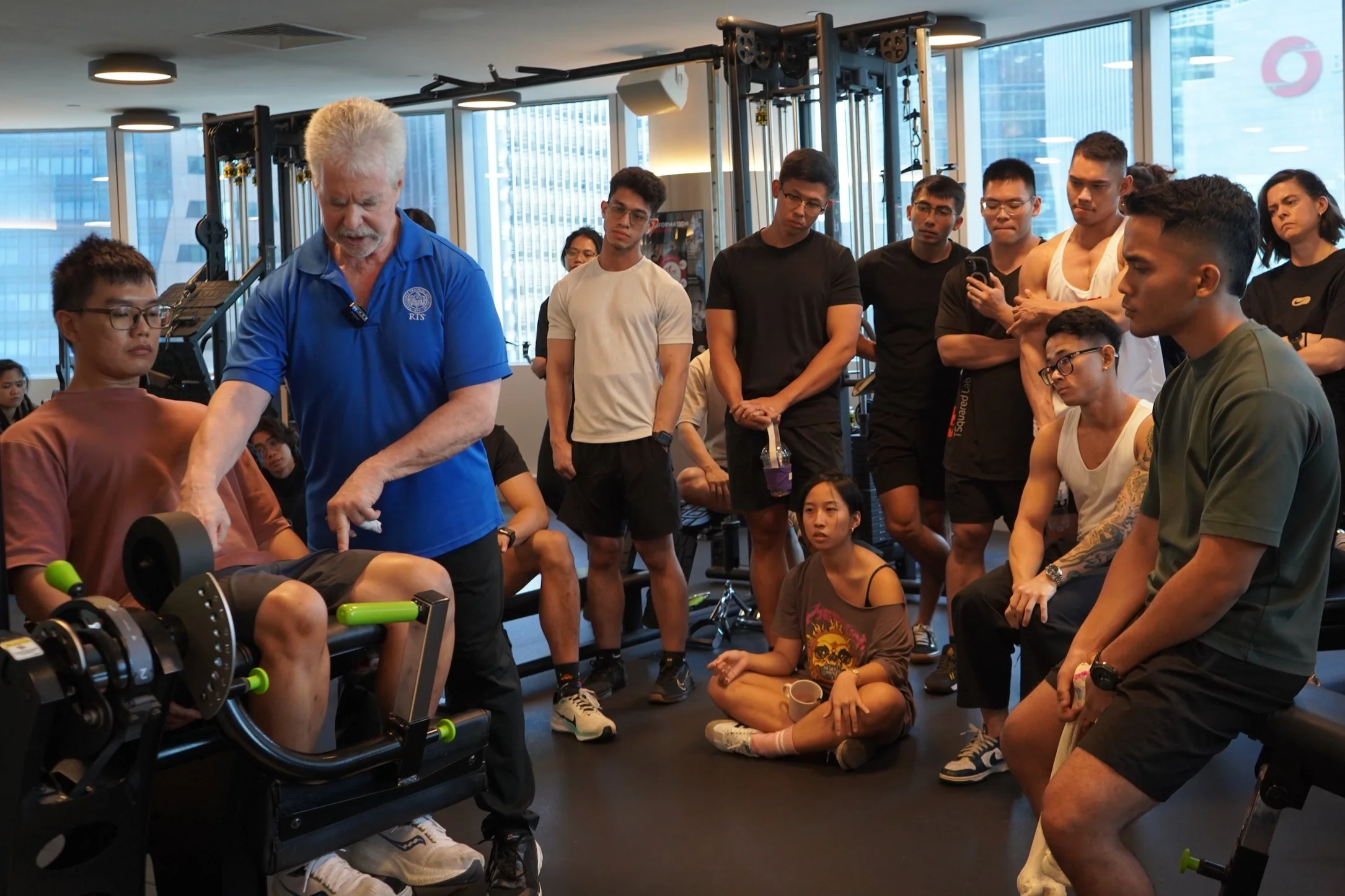 Dr Mark Slavin demostrating cueing for a leg extension on an RTS Level 1 hands-on practical workshop in Singapore