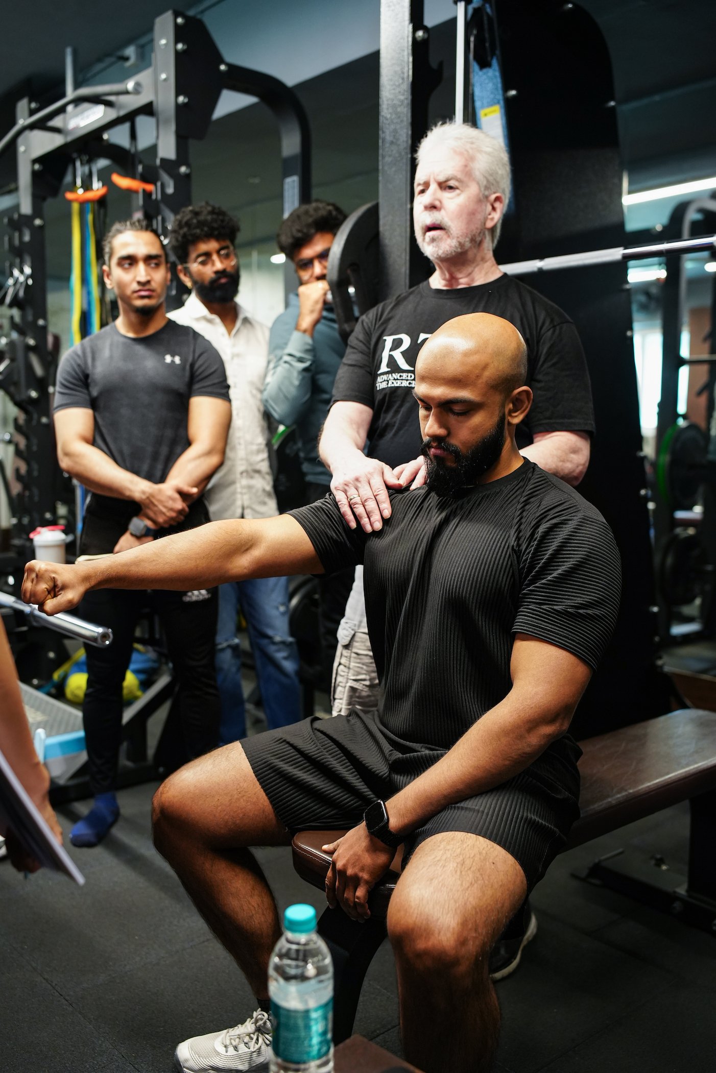 Dr Mark Slavin explaining to students at a practical workshop in Bangalore, India, the importance of understanding the glenohumeral joint when designing pressing exercises for clients