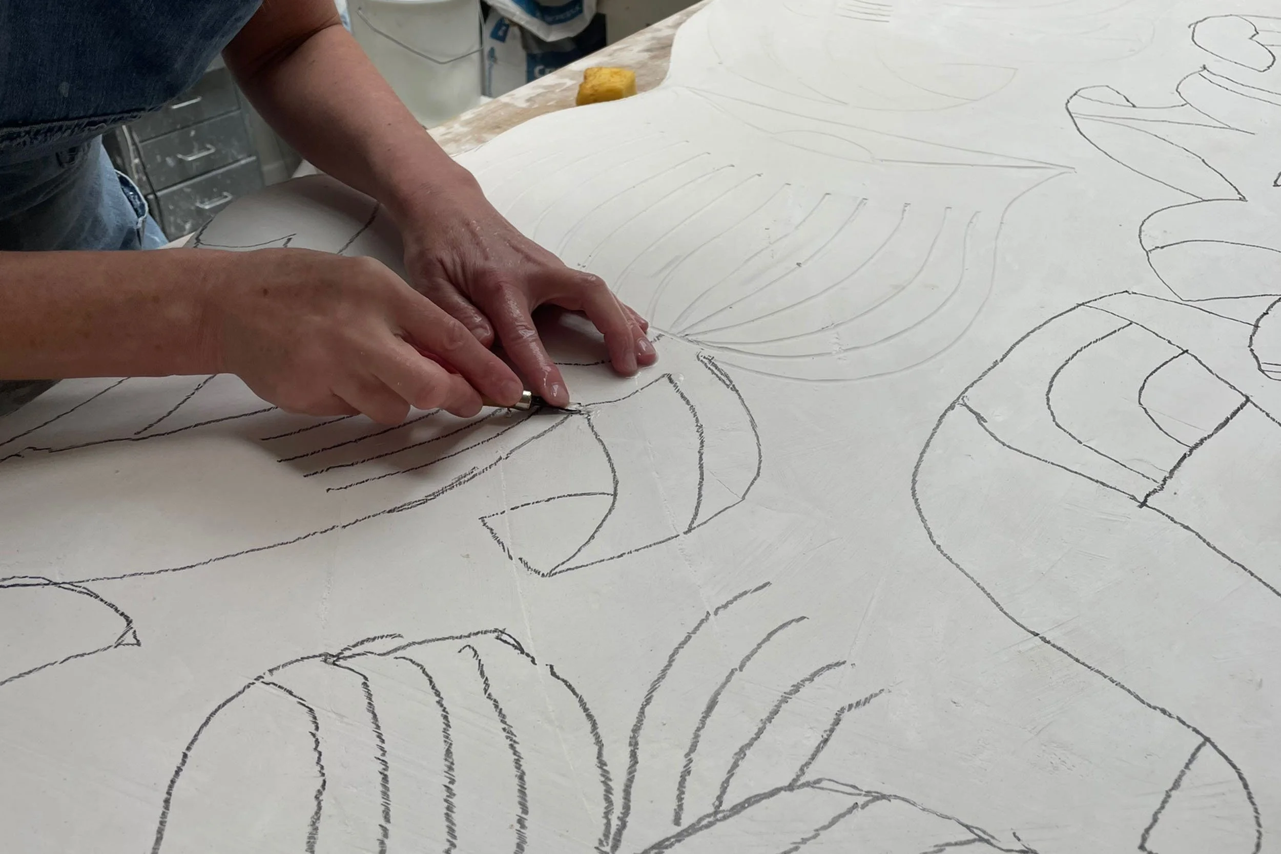 Petra Börner  detail drawing on plaster mural relief in Helen Johannessen London studio.he Montcalm Mayfair Hotel artwork.