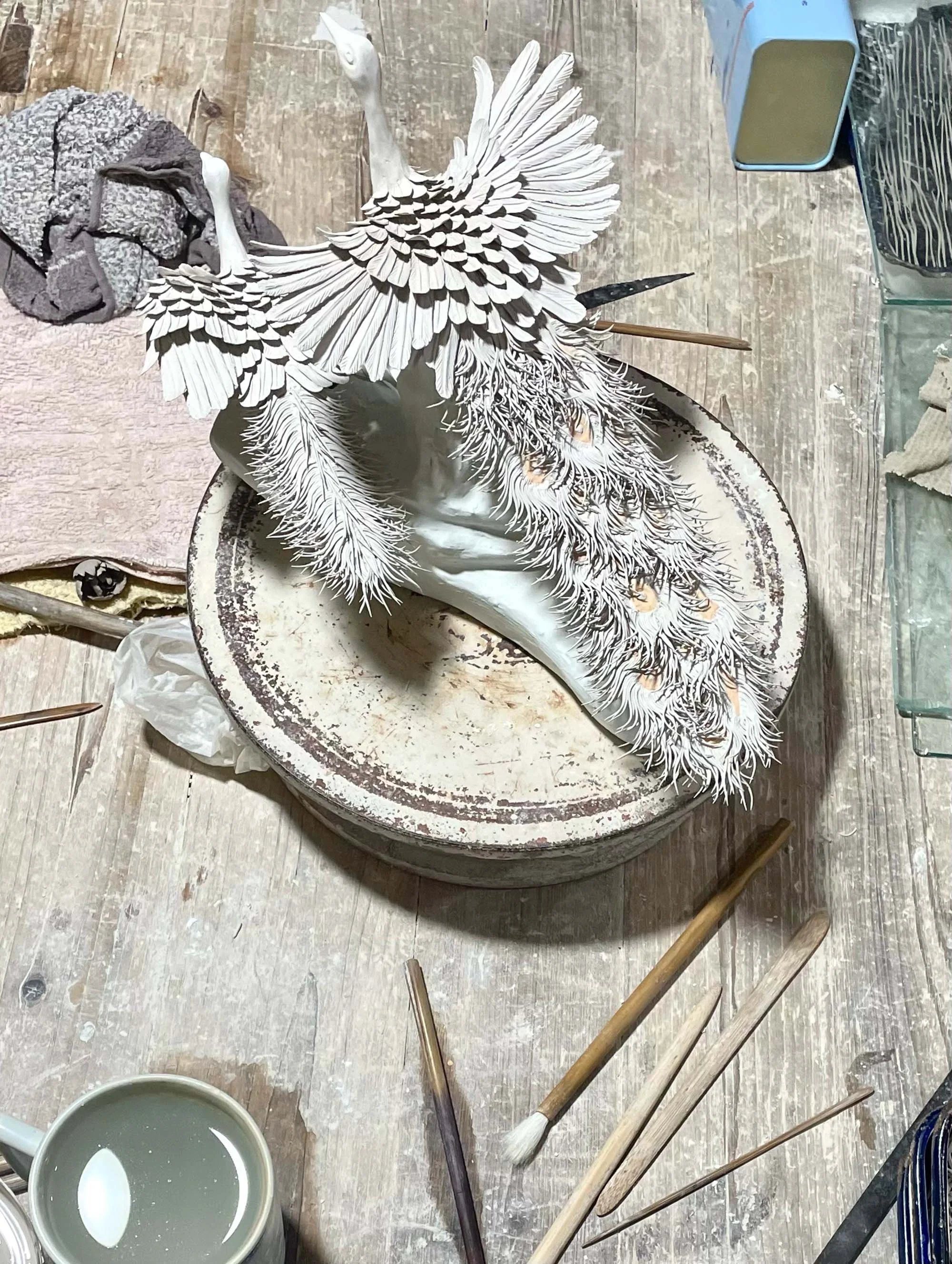 Handmade porcelain bird sculpture, Jingdezhen workshop.