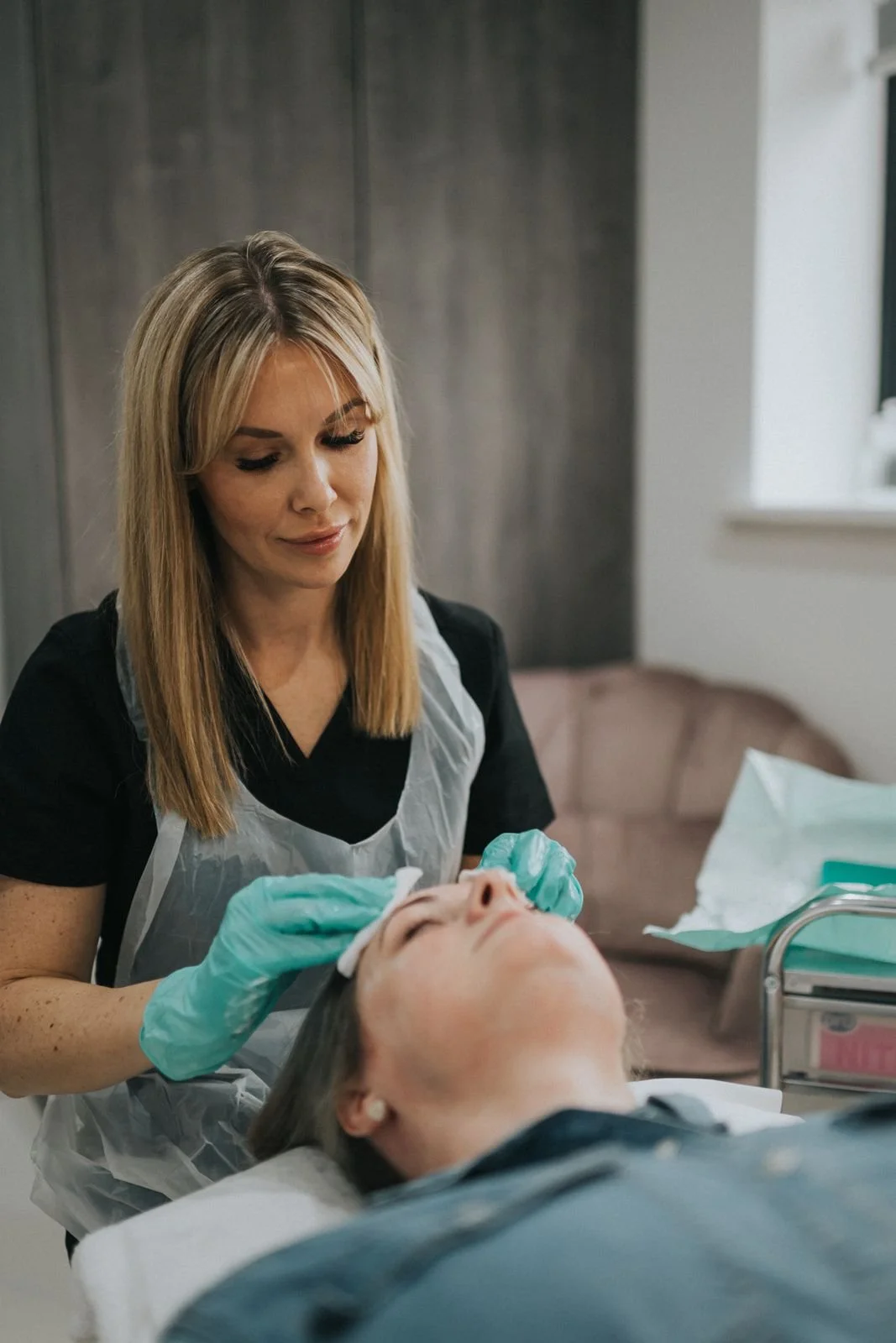 Aesthetic practitioner Natasha Holden providing a professional microneedling procedure.