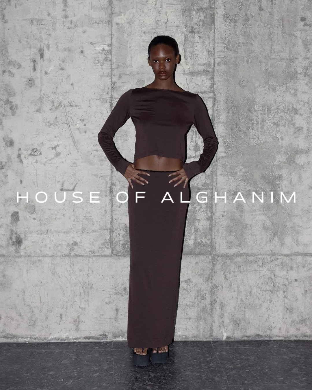 Model wearing 2-piece brown outfit designed by House of Alghanim