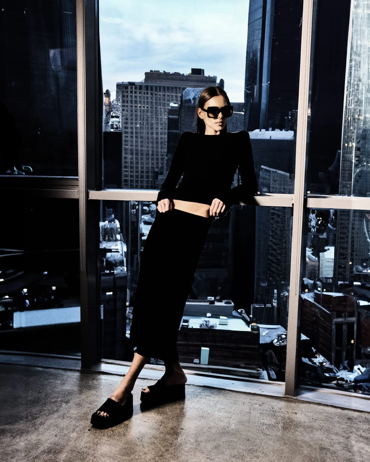Model wearing 2-piece black outfit designed by House of Alghanim