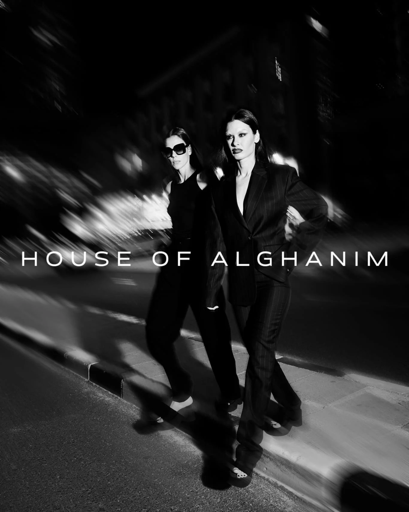 Models wearing all-black outfits designed by House of Alghanim