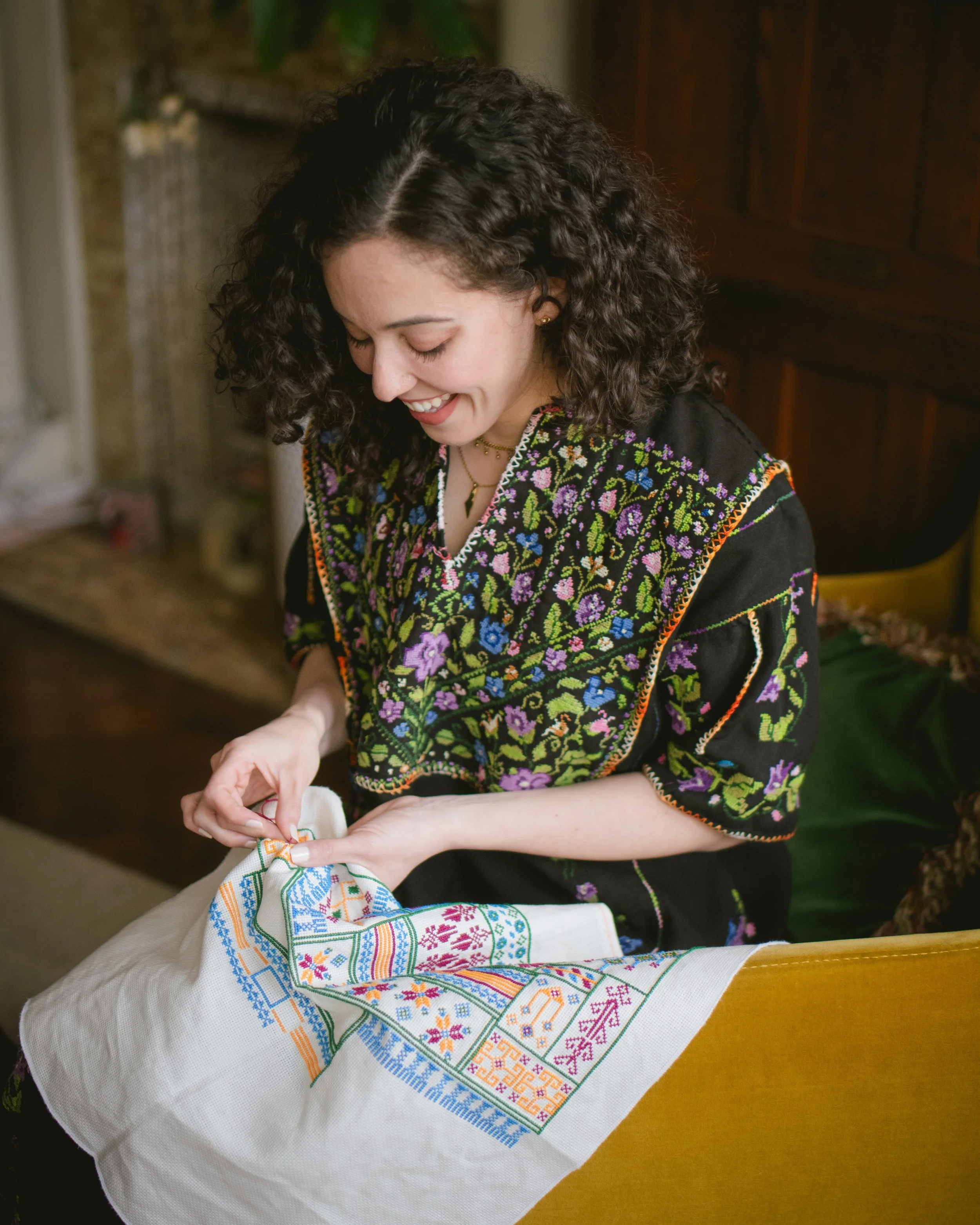 Lina's Thobe | Lina embroidering