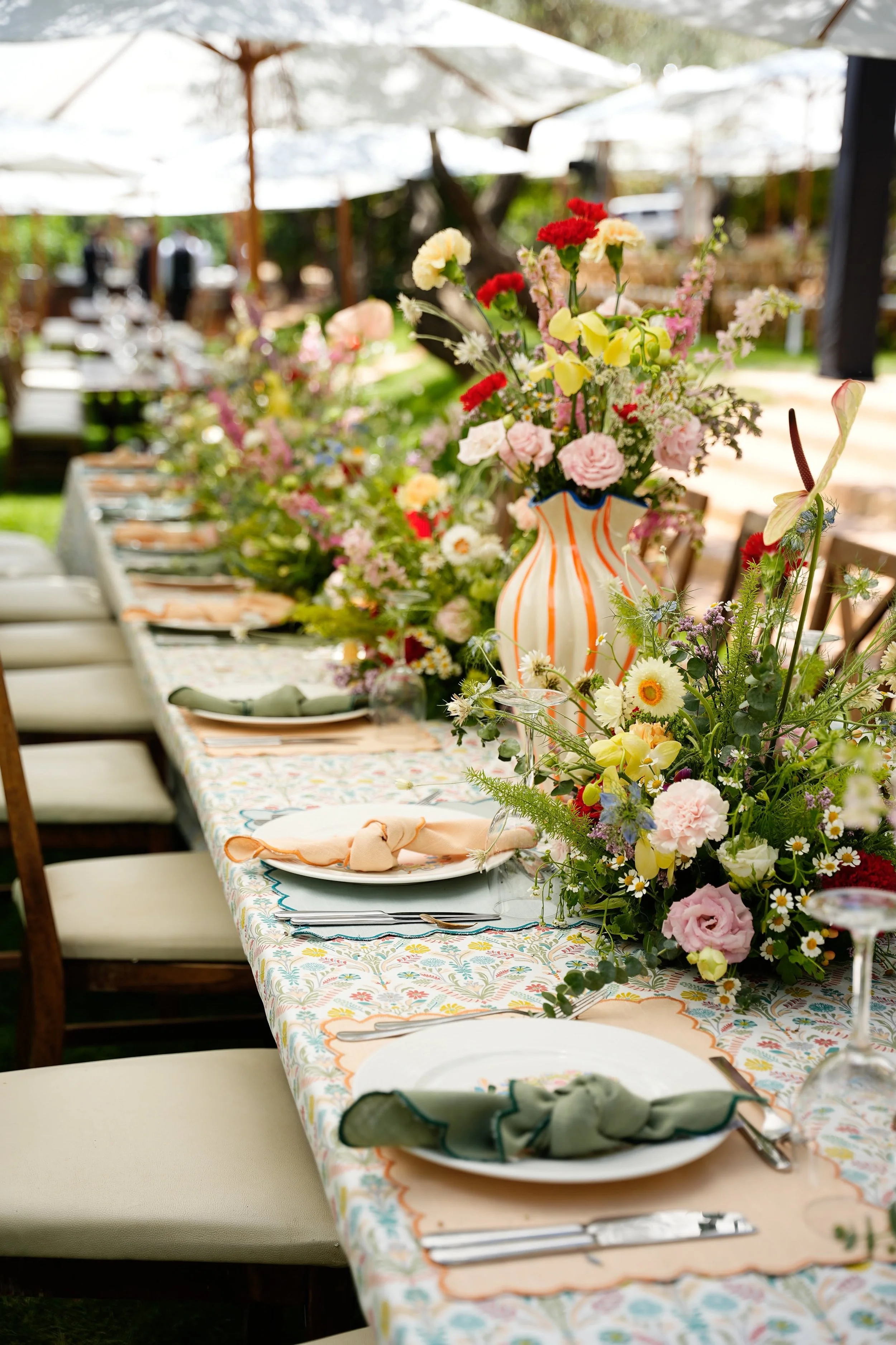 Beautiful flower arrangements displayed on a table setting designed by Sincerely Yours
