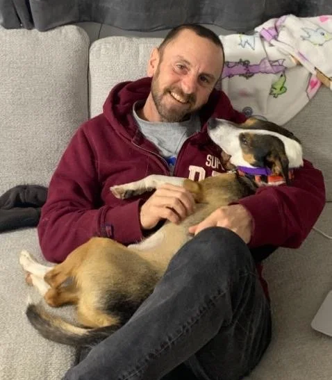 Dog trainer - dog behaviourist enjoying time with a board and train dog