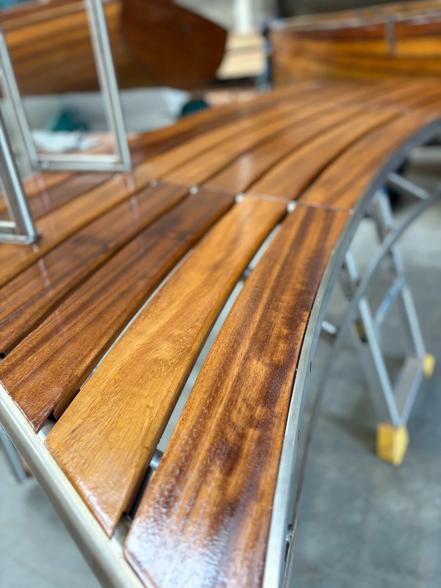Close-up of the curved timber boards and finish on the swim platform