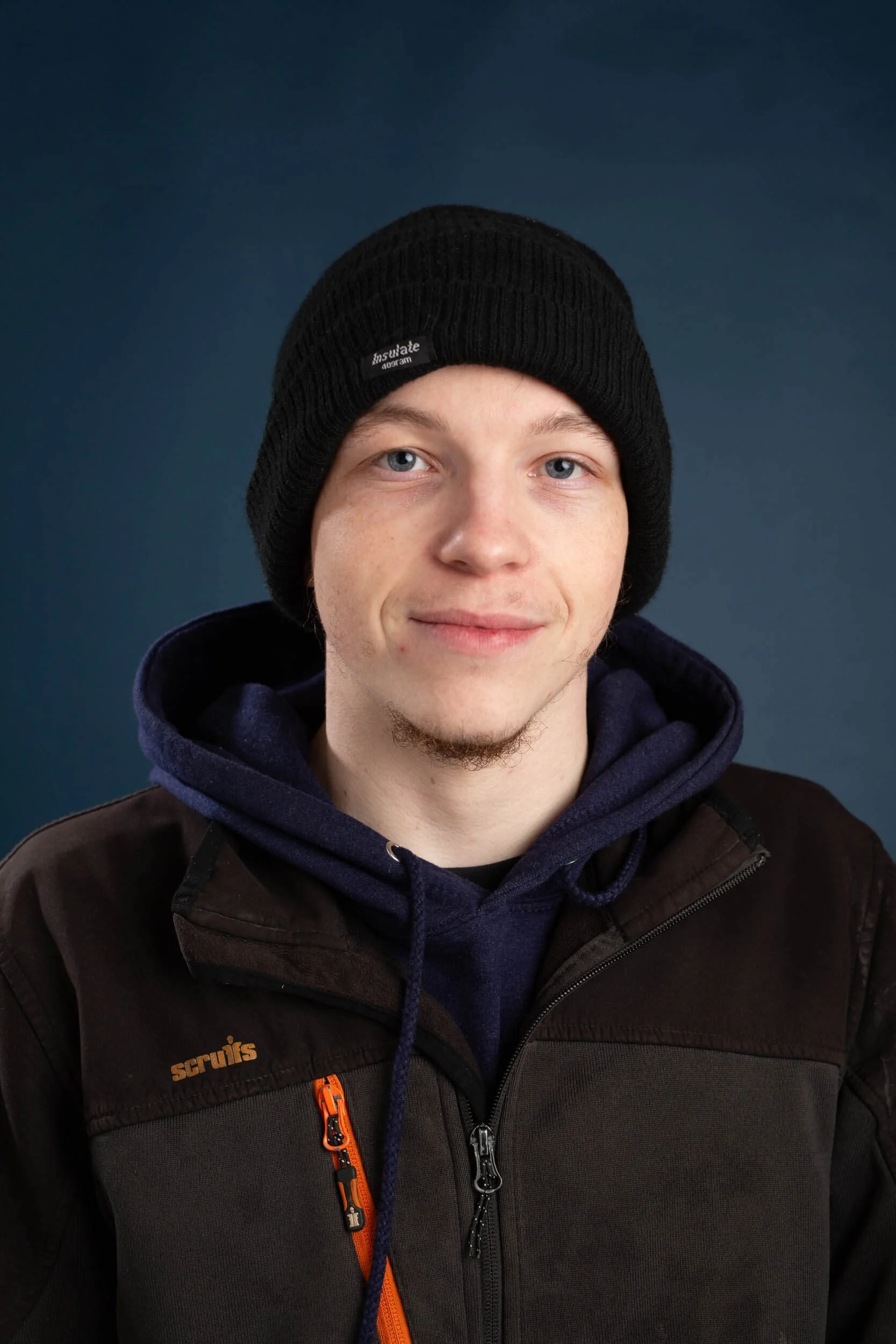 zak wearing black hat on blue background eyemouth electrician berwick professional trained