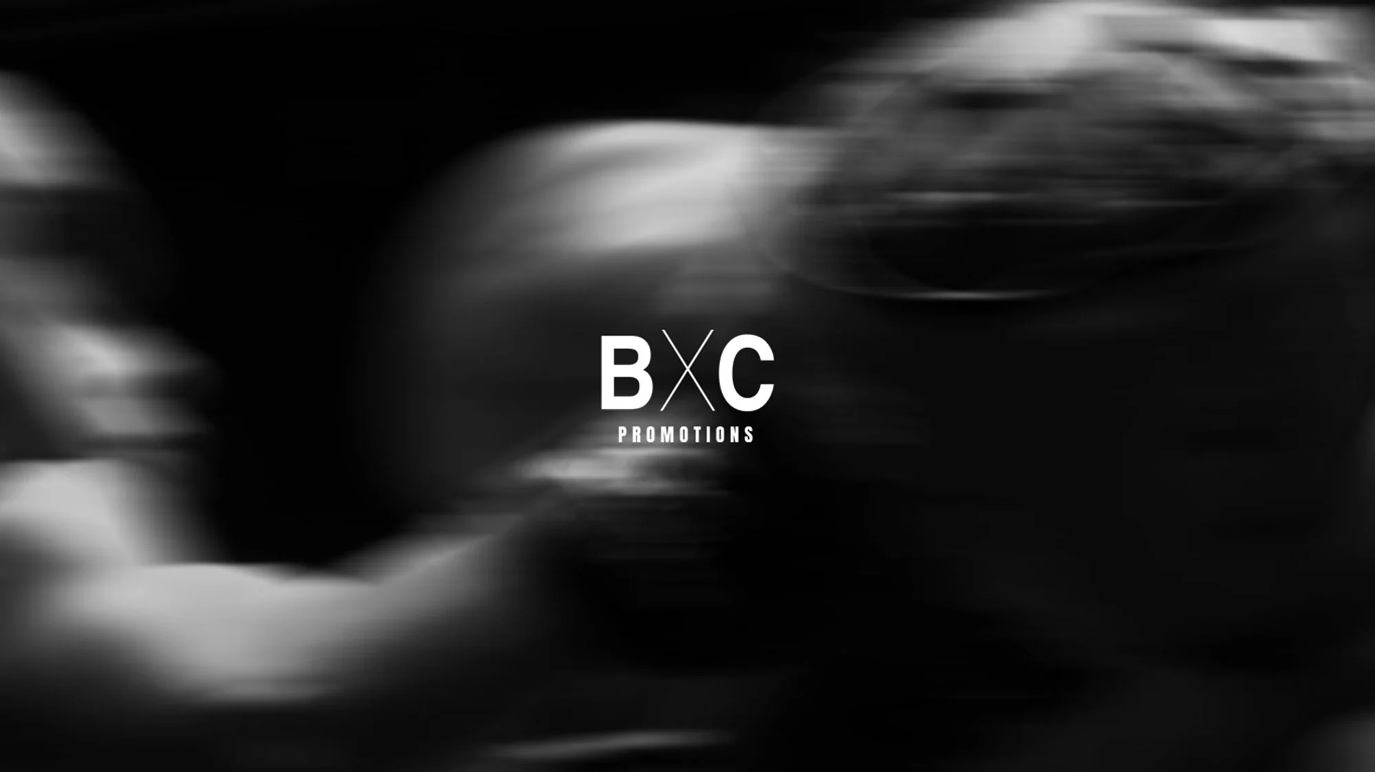 Black and white abstract background with blurred motion and a central logo that reads 'BXC Promotions'.