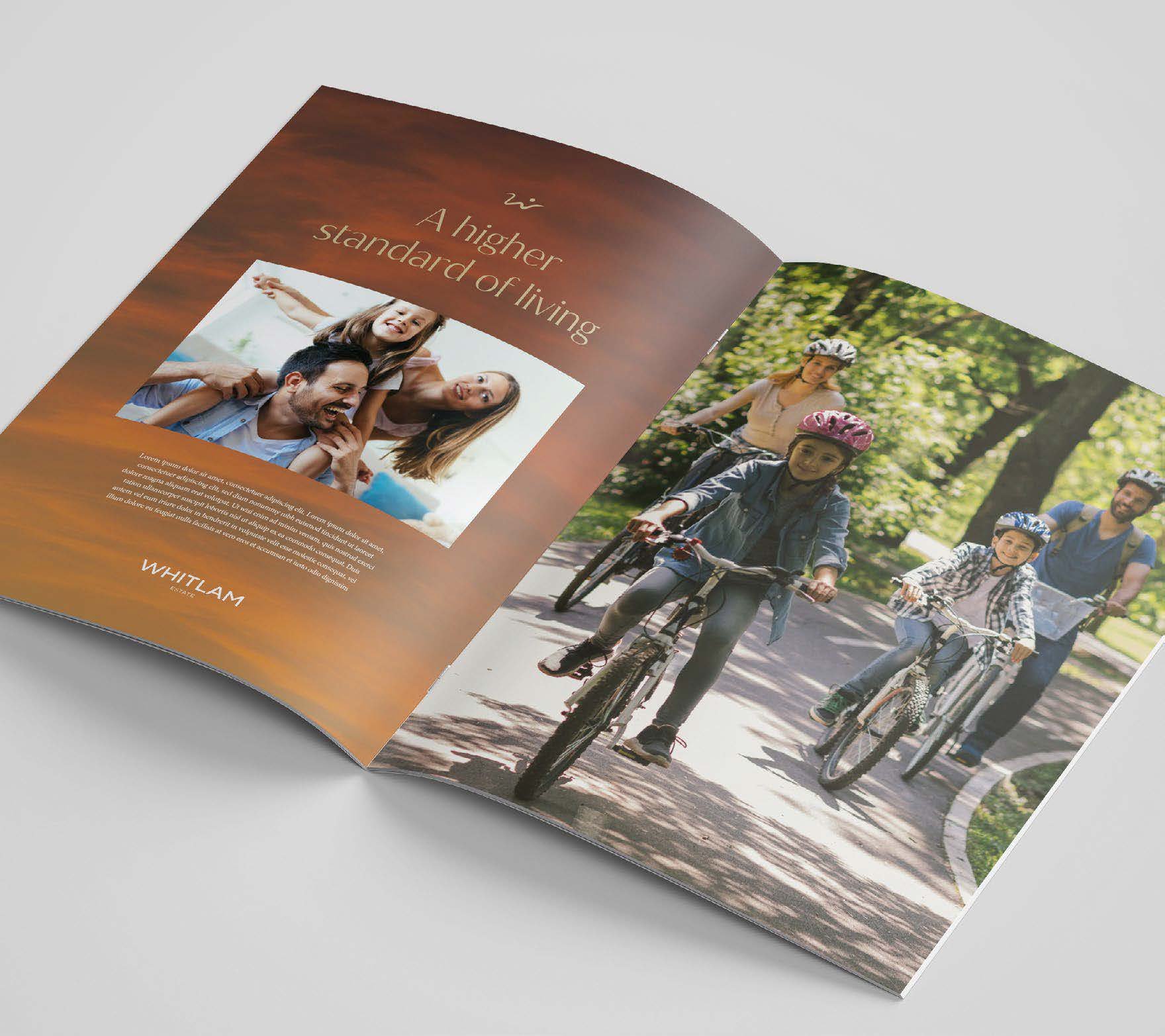 Open magazine with a two-page spread, featuring a family riding bikes in a park on the right and a scenic sunset with family on the left, along with the text 'A higher standard of living' and the name 'WHITLAM' at the bottom.