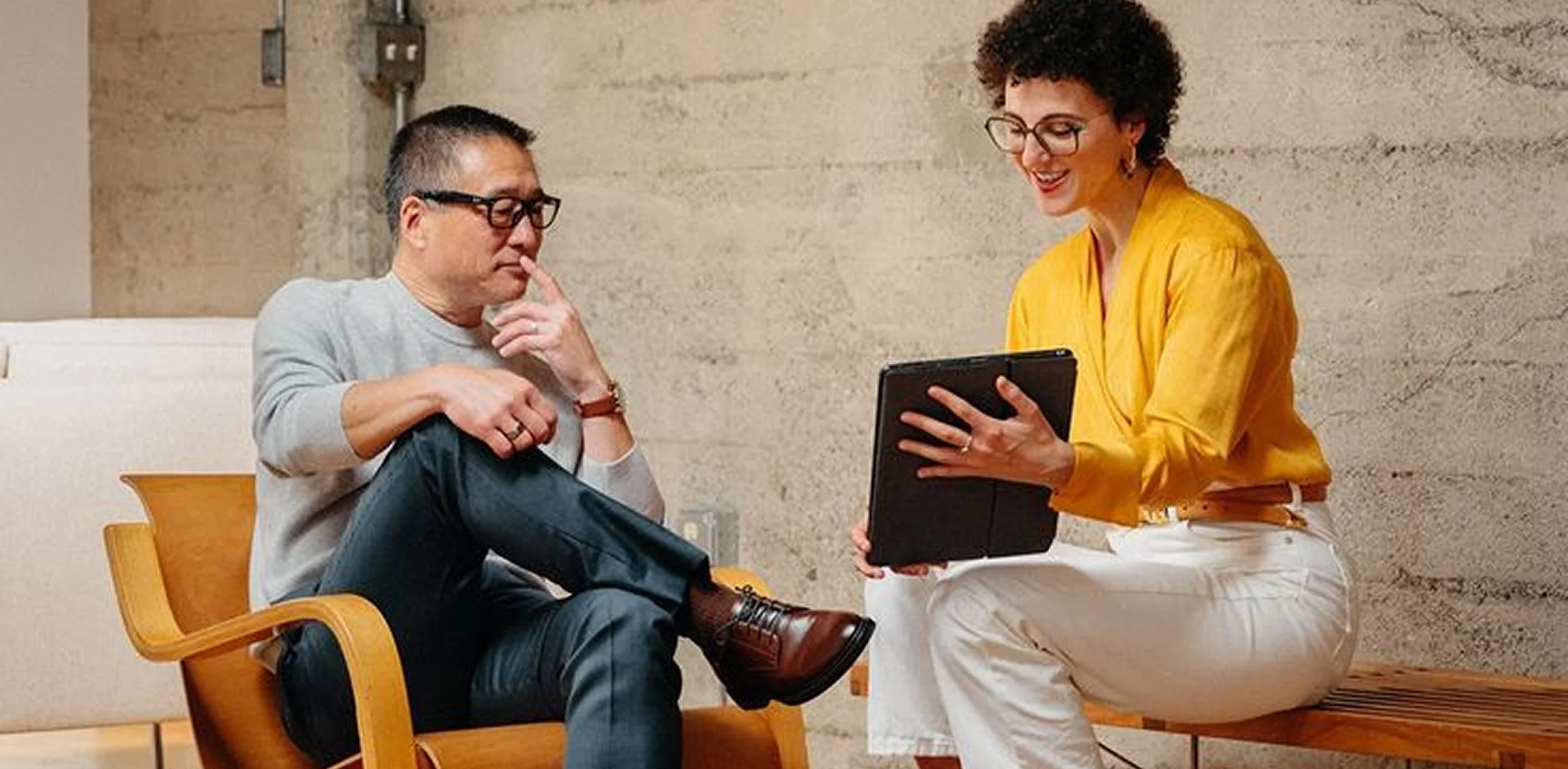 Man and woman sharing an iPad