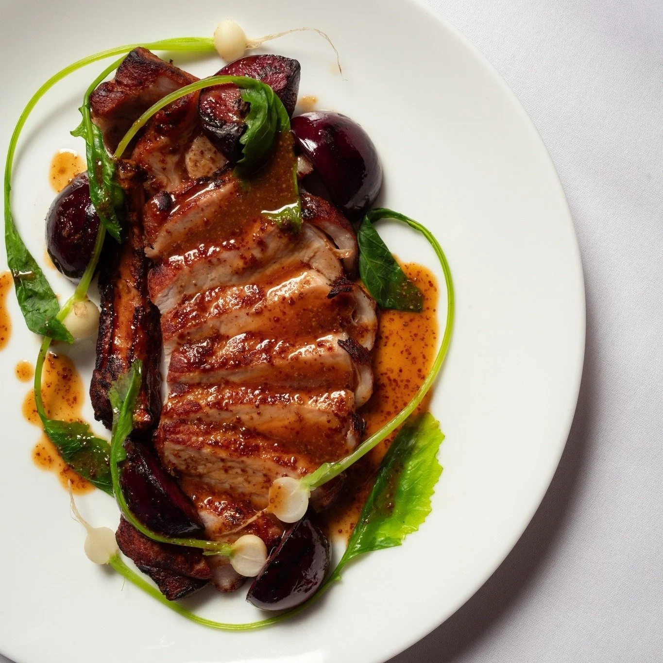 Seared pork cutlet with baby turnips &amp; plums, glossed with a softly spiced mustard sauce. On the menu for now, while the last of the summer plums are still with us.

📸 @isabellagwild