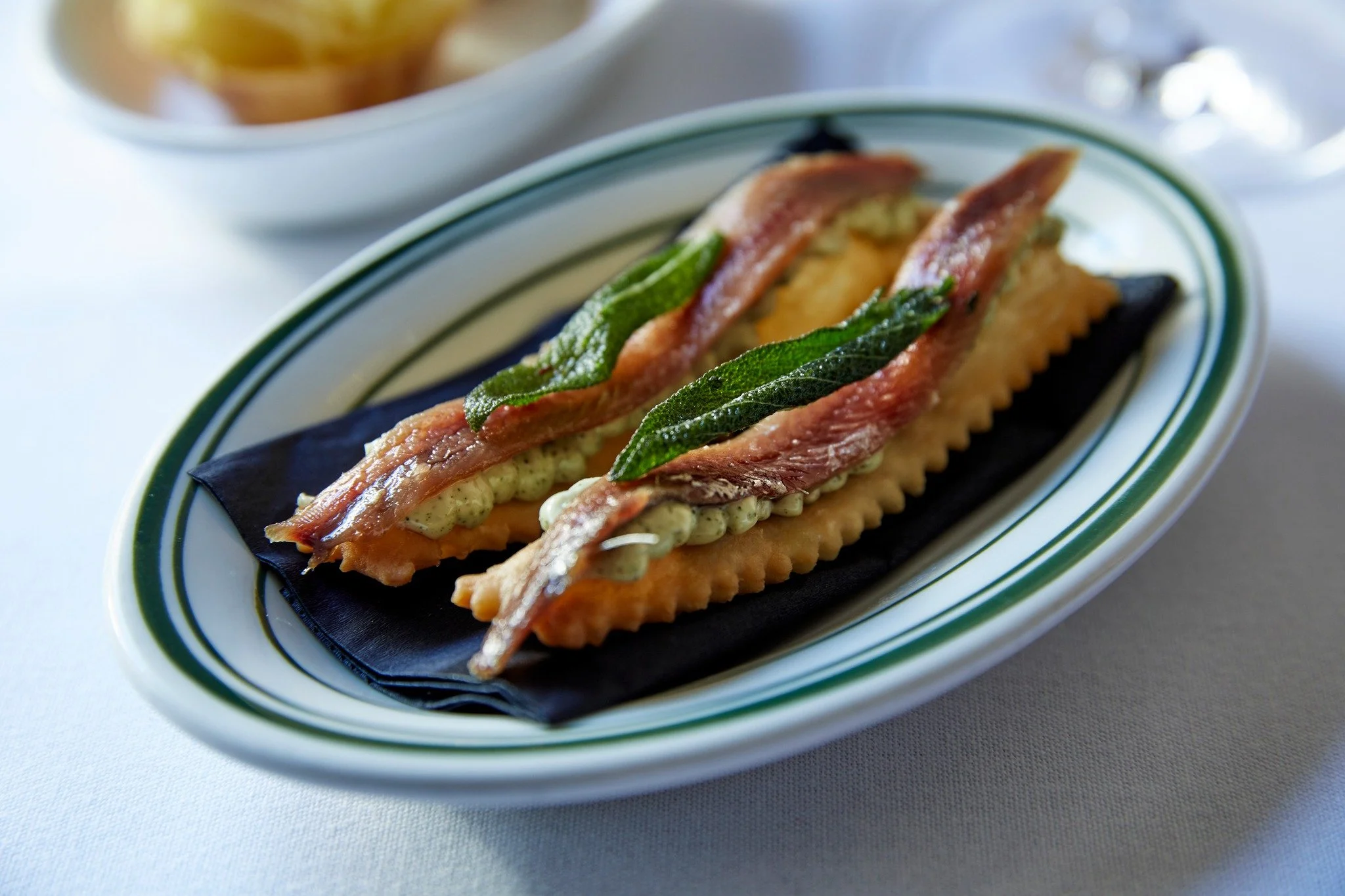 A classic for a reason - golden, crisp gnocco fritto with sage aioli &amp; anchovy. Perfect with a glass of chilled manzanilla, a little vermouth, perhaps a martini?

📸 @jennifersoophotography