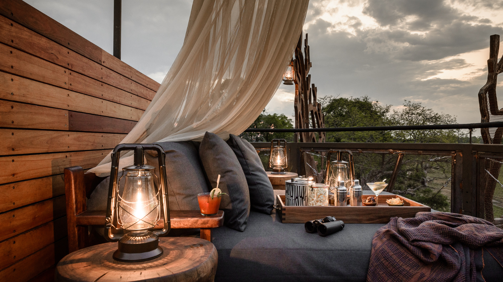Xigera Safari Lodge Botswana luxury tent with outdoor deck overlooking Okavango Delta at sunset