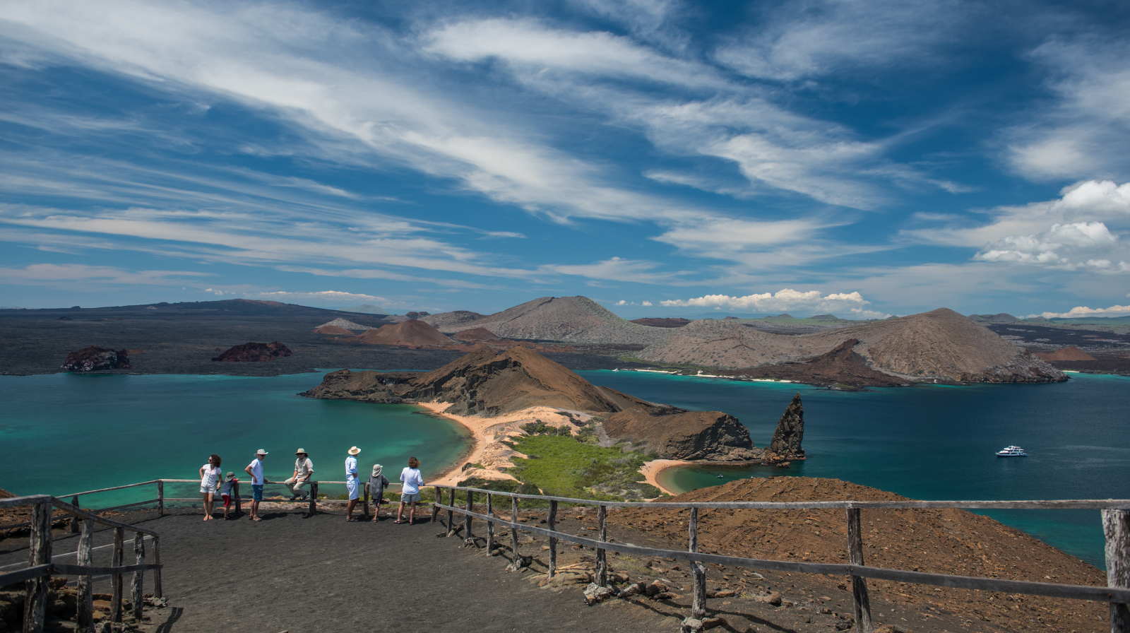 Galapagos Islands volcanic landscape with tourists at Pikaia Lodge luxury wildlife retreat Ecuador