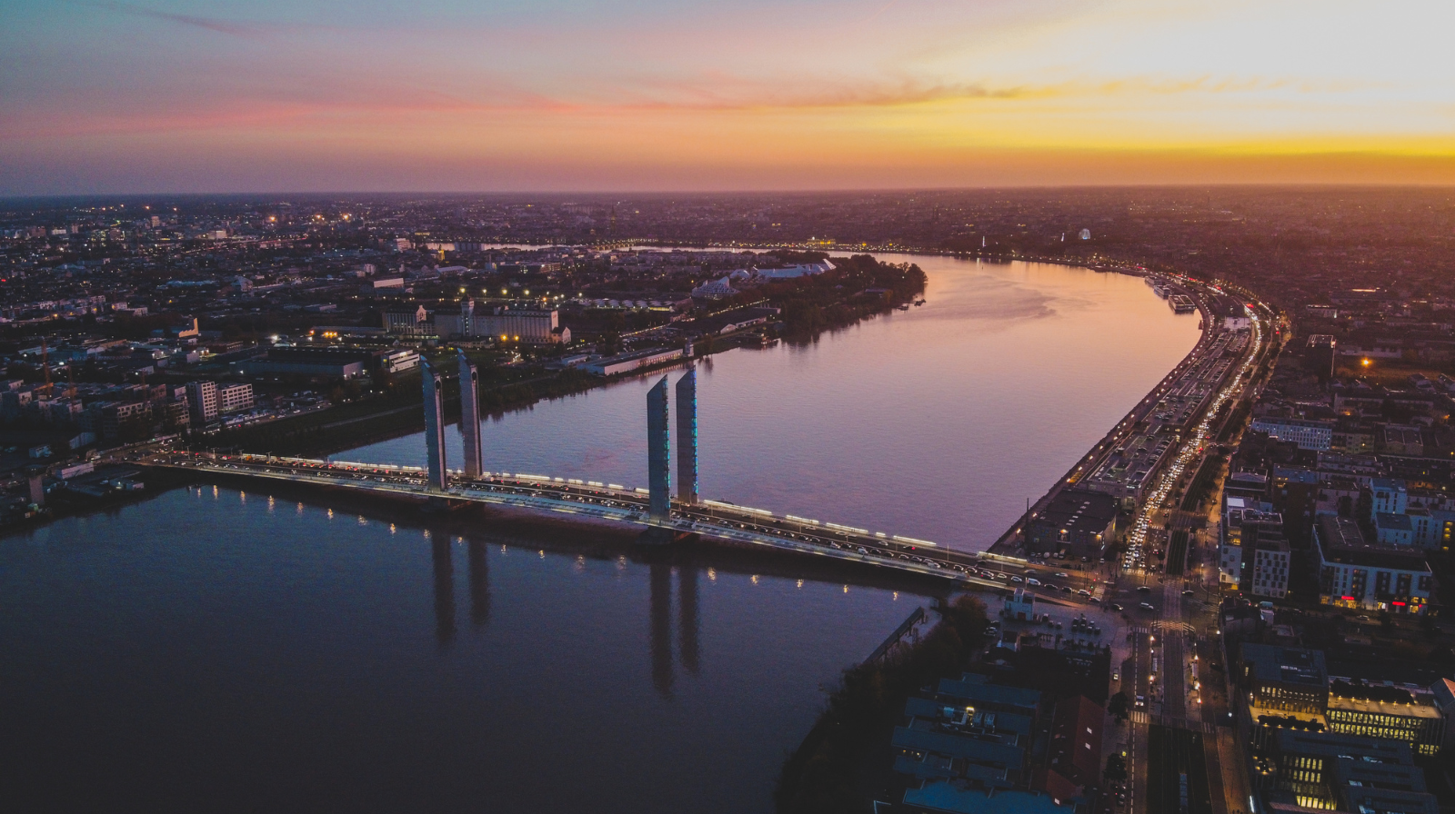 Aerial view of Chaban-Delmas Bridge over the Garonne River at sunset in Bordeaux