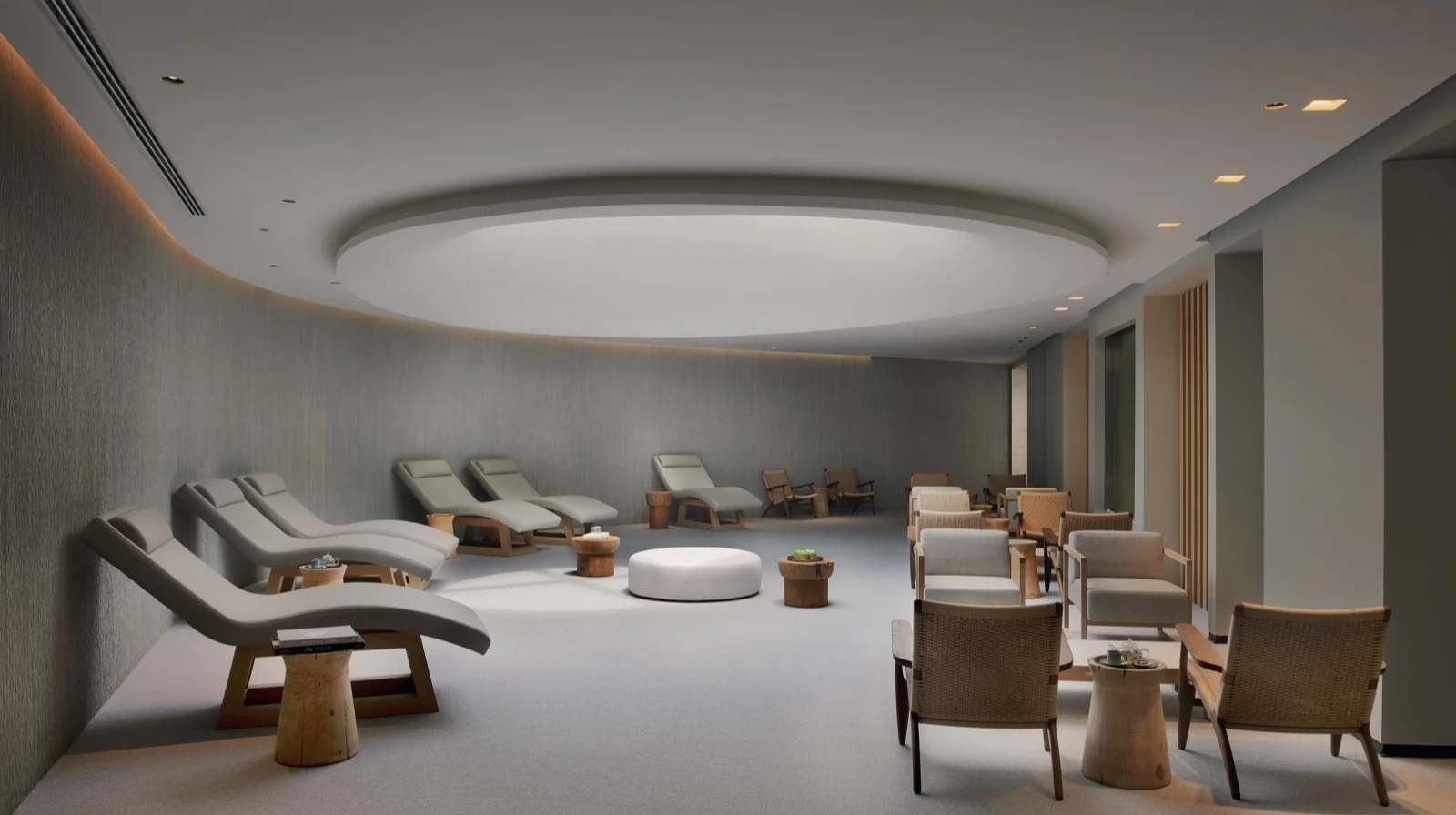 Modern spa relaxation room with lounge chairs and curved ceiling at Six Senses Kaplankaya Turkey