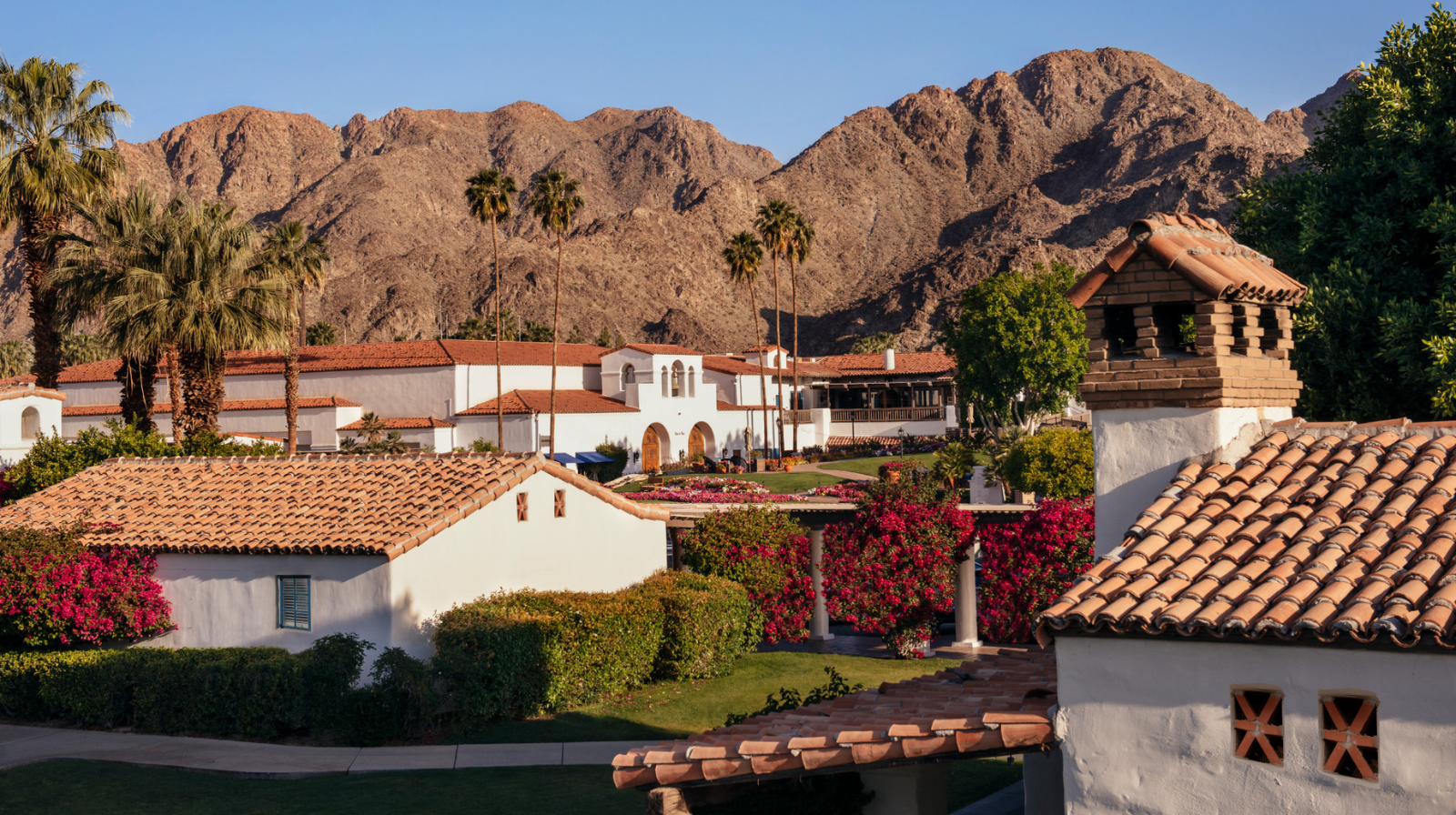 La Quinta Resort and Club Spanish colonial architecture with red tile roofs and desert mountains Palm Springs California