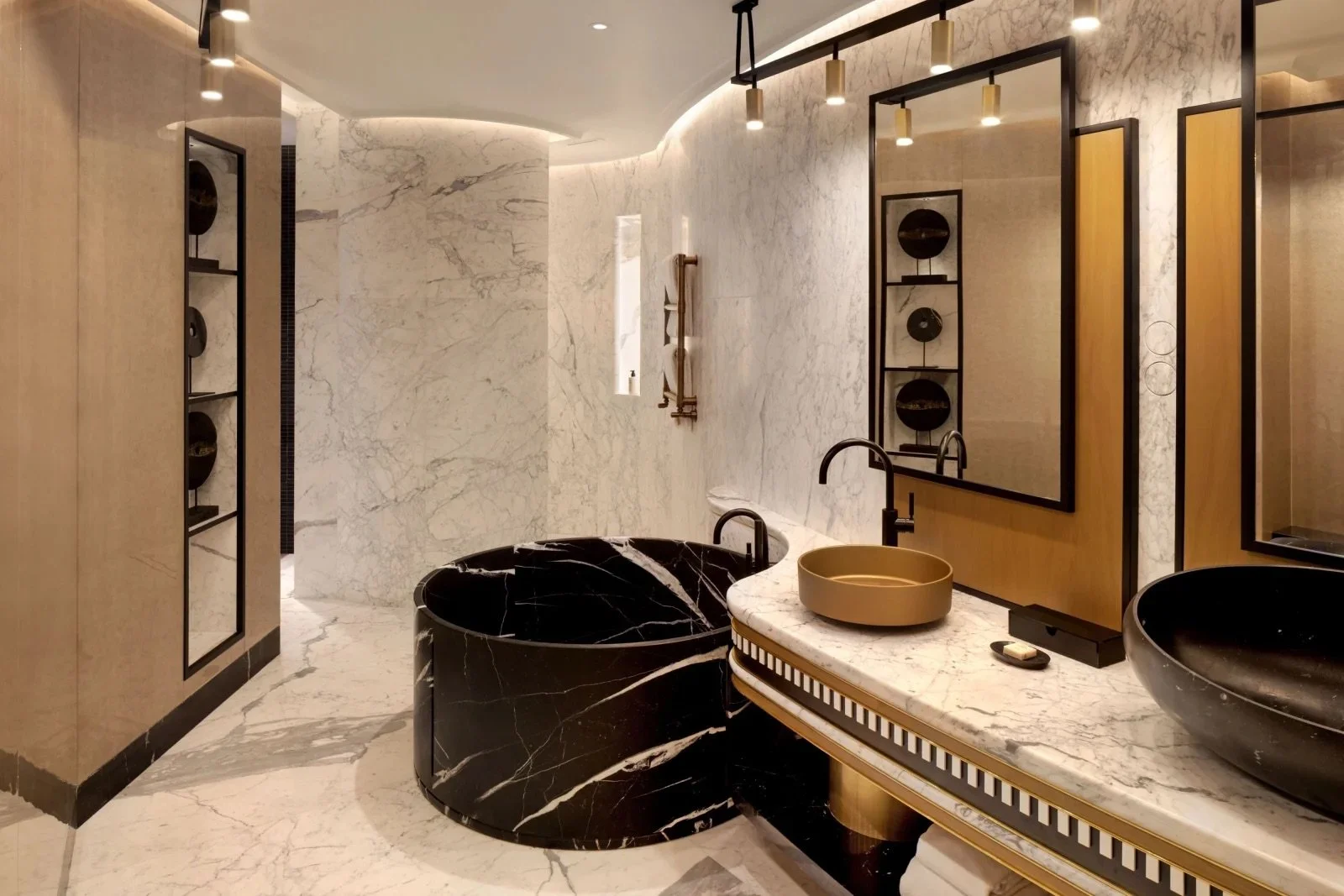 Luxurious marble bathroom at Paragraph Freedom Square, A Luxury Collection Hotel in Tbilisi, Georgia, featuring a modern black soaking tub, designer sinks, and elegant lighting—ideal for travelers seeking upscale accommodations in central Tbilisi.