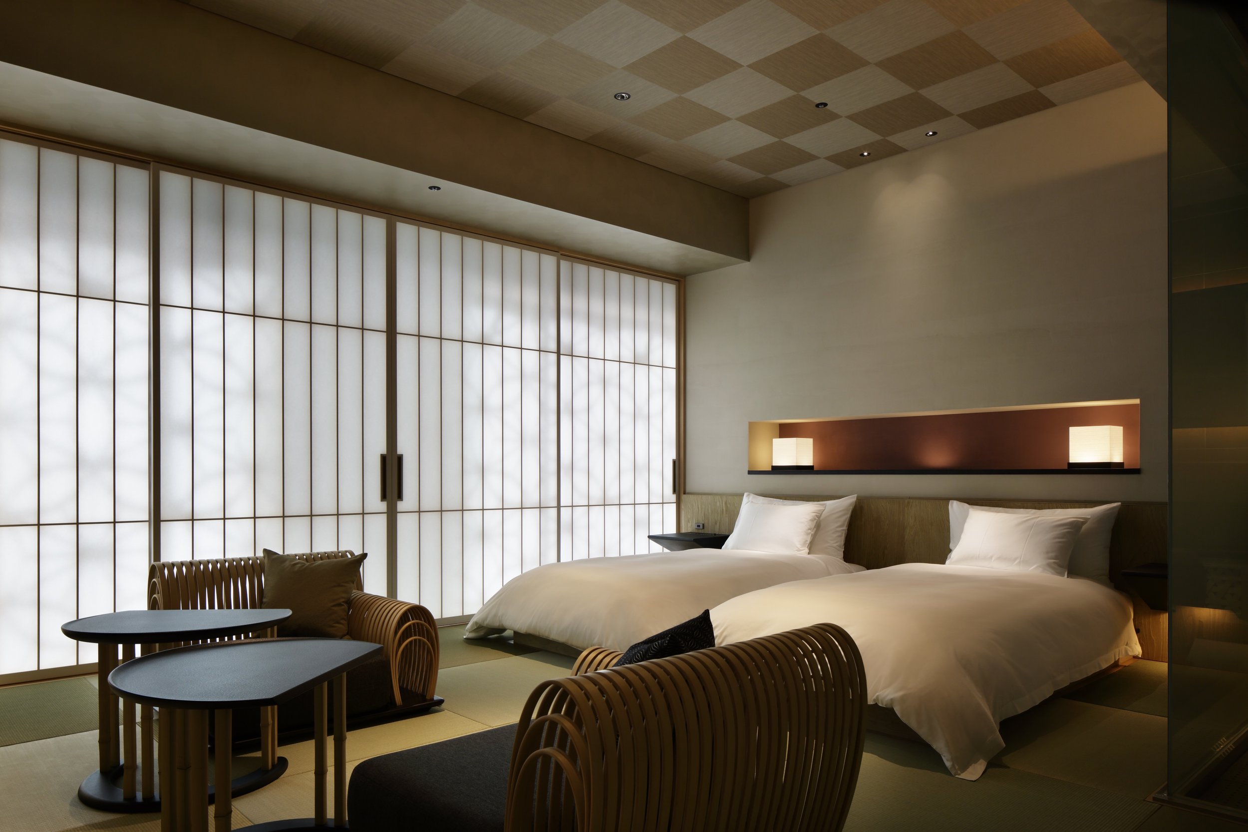 Spacious Sakura guest room at Hoshinoya Tokyo featuring twin beds, contemporary Japanese design, tatami flooring, and traditional shoji screens