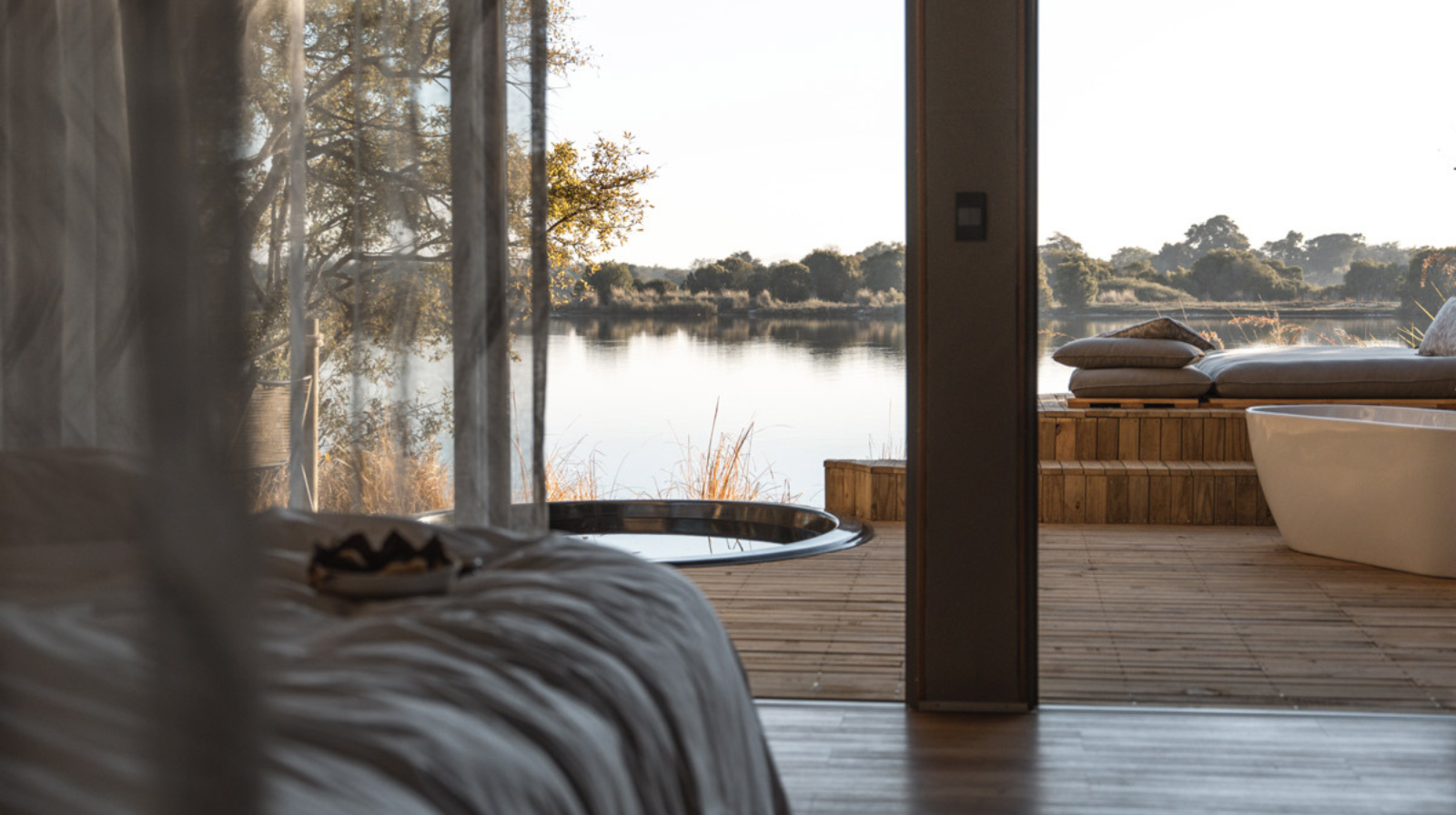 Victoria Falls River Lodge Zimbabwe luxury tent with private deck and outdoor bathtub overlooking Zambezi River