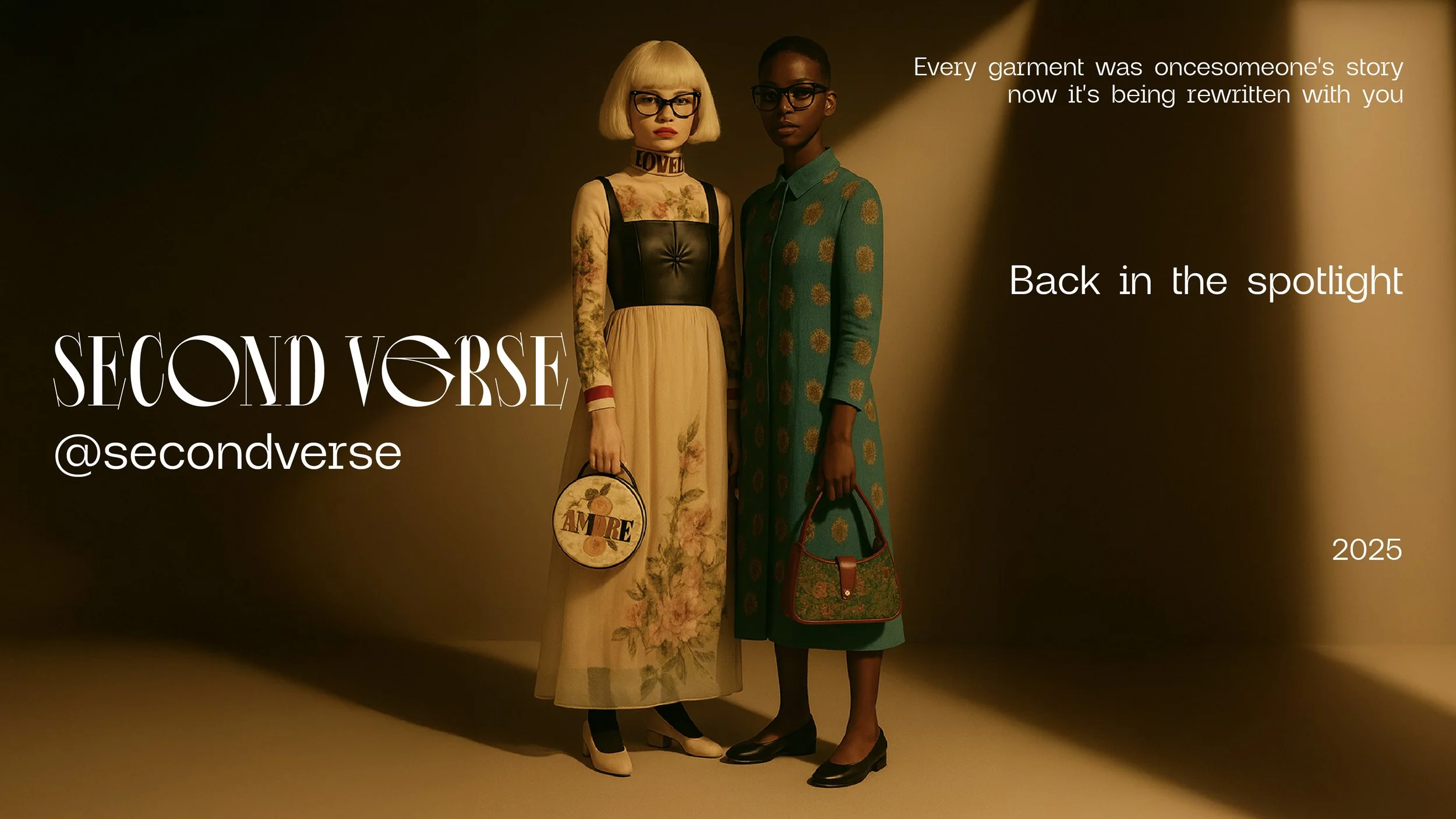 Two models standing side by side in a dimly lit studio with a beige background. The model on the left has a blonde bob haircut, glasses, and wears a sheer long-sleeve top with floral embroidery, a black leather bustier, and a beige floral skirt, hold
