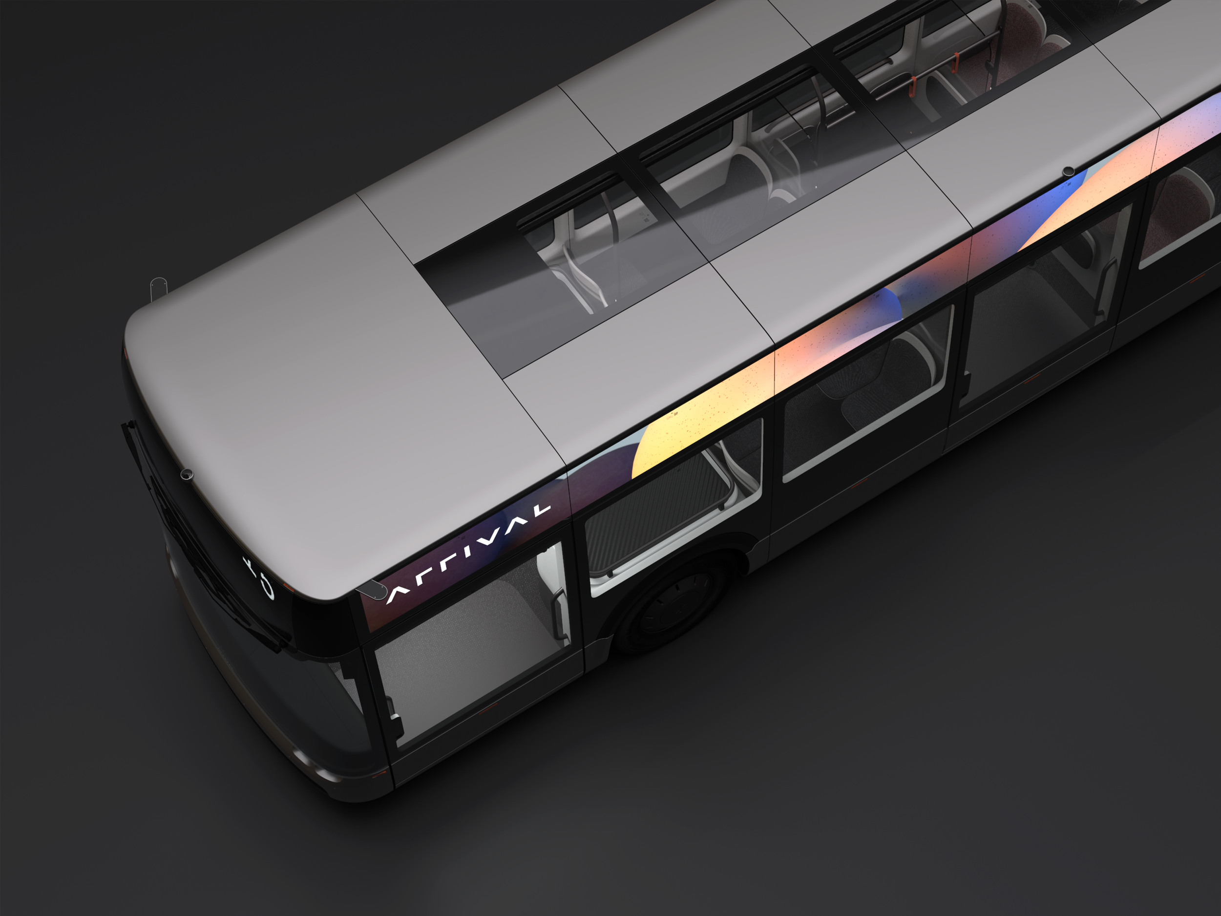 A modern electric bus with a digital display on the front, showing a stylized graphic, and large windows through which interior seats and handrails are visible, set against a black background.