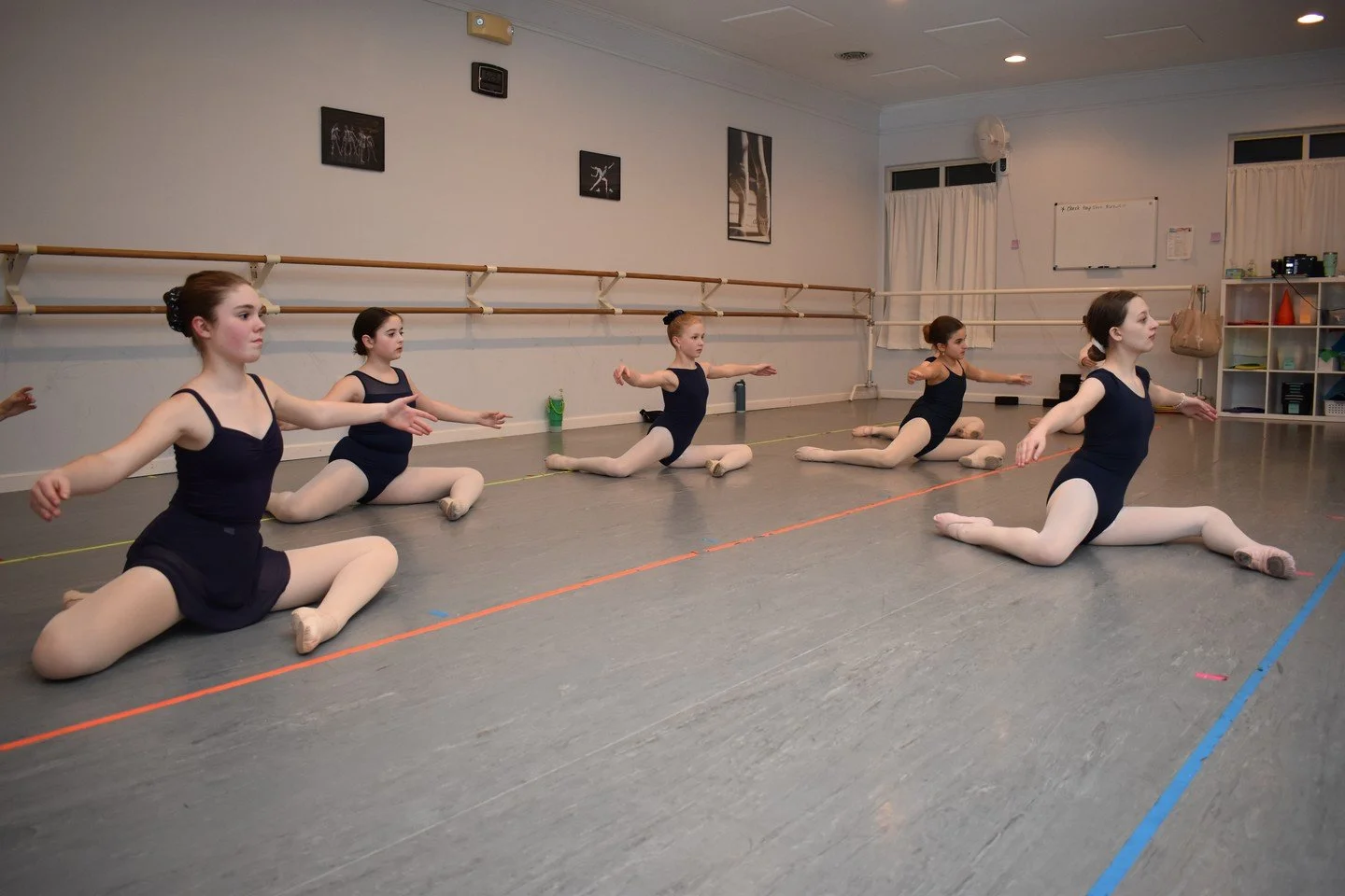 I am fairly certain that the senior dancers see my camera bag and cringe. (They love me, I promise. They just don't like having their pictures taken.) 

One of the biggest parts of ballet is making it all look effortless. Yes, even in conditioning cl