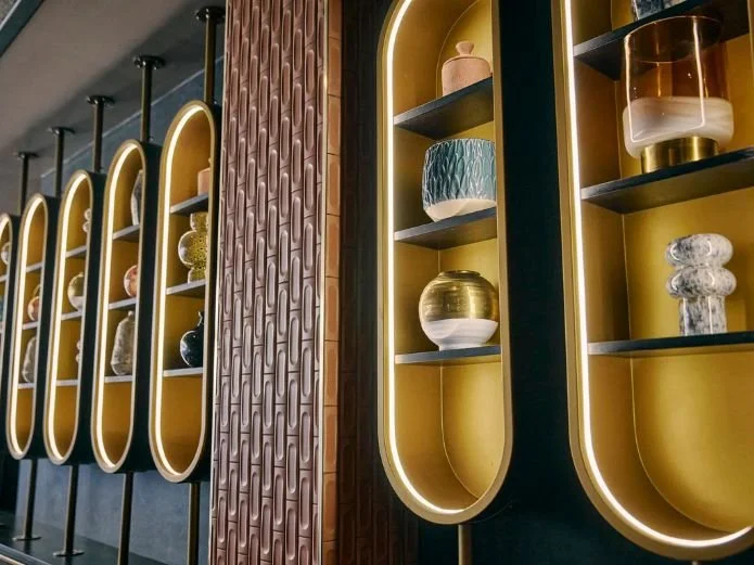 Display shelves with decorative vases and containers in a modern interior interior design.