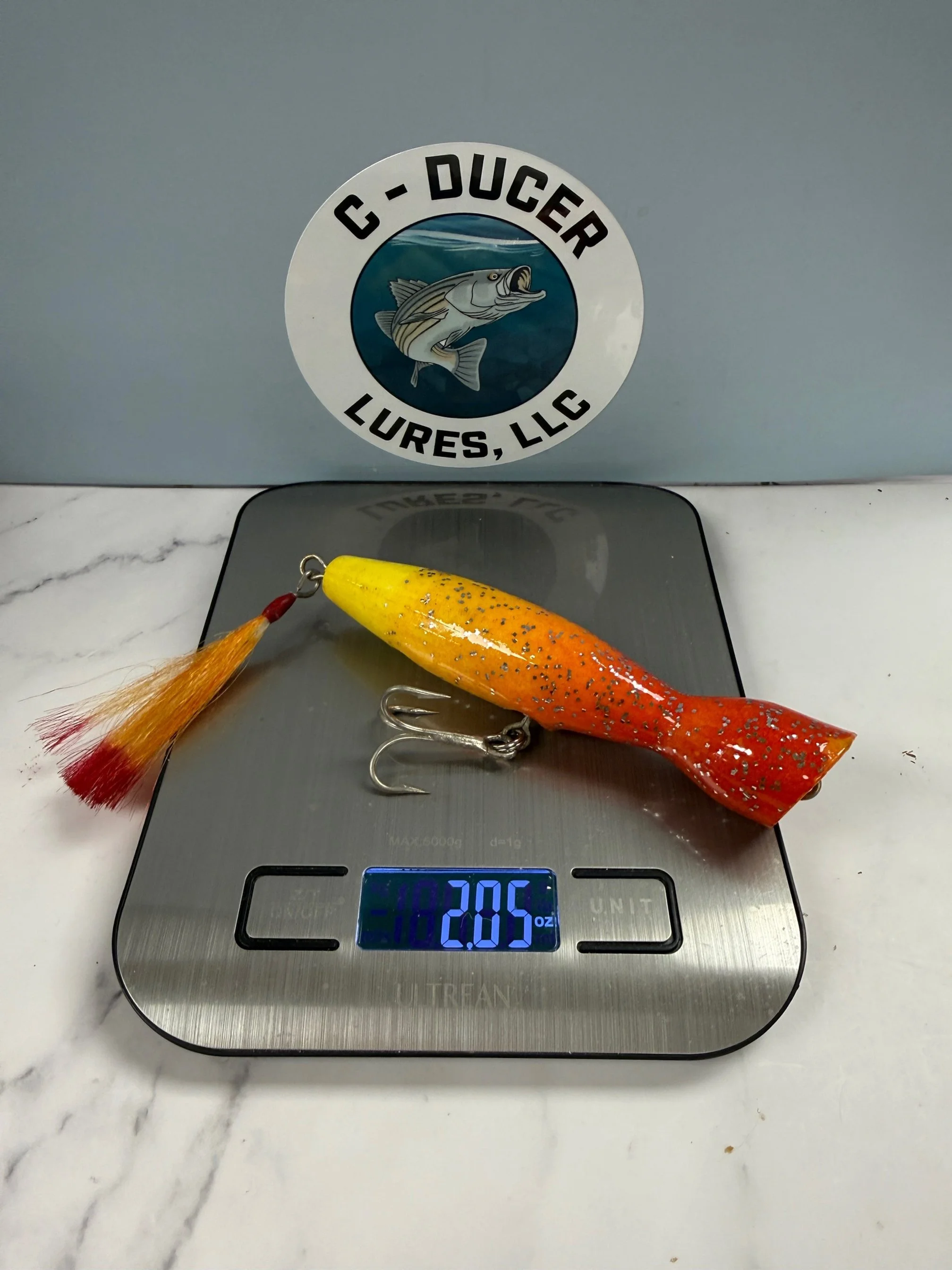 Popper.  Striped Bass.  Saltwater.  Fire Tail Flag.