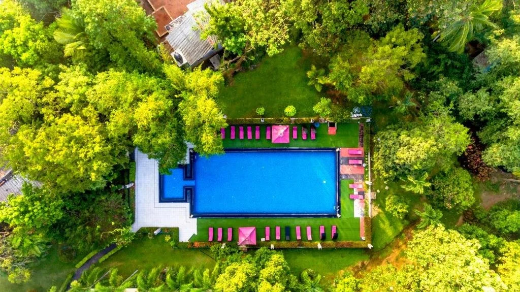 Aerial view of the swimming pool and tropical gardens at Heritage Hotel Anuradhapura