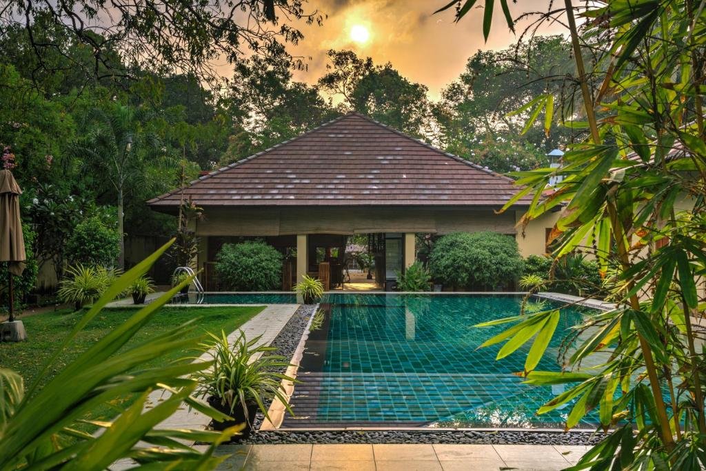 Swimming pool surrounded by tropical gardens at The Spice Trail in Arugam Bay