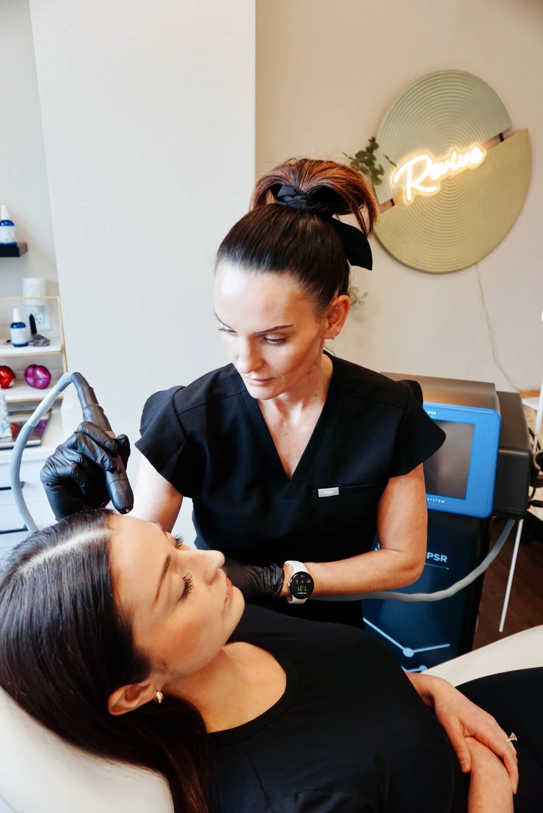 A woman getting a cosmetic procedure performed by a professional in a clinic.