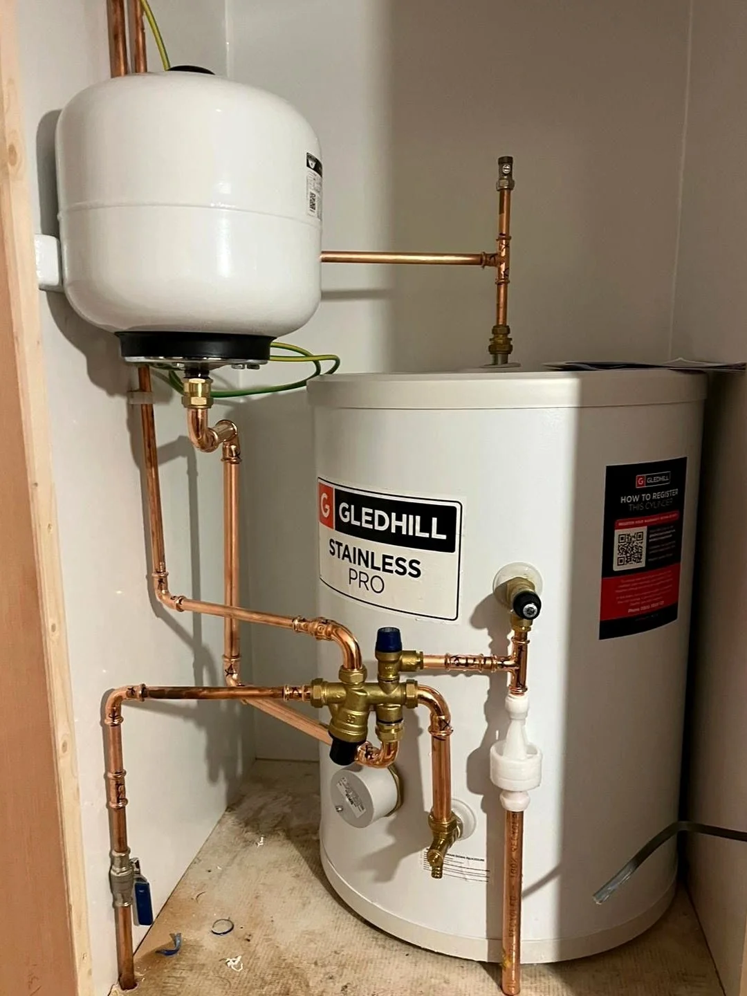 Unvented hot water cylinder installed neatly in a Brighton home