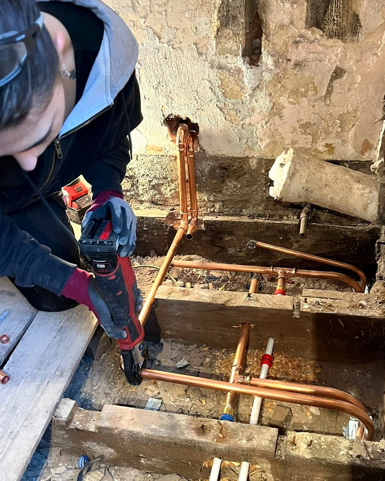 Gas central heating pipework being installed as part of a new heating system in a Brighton home