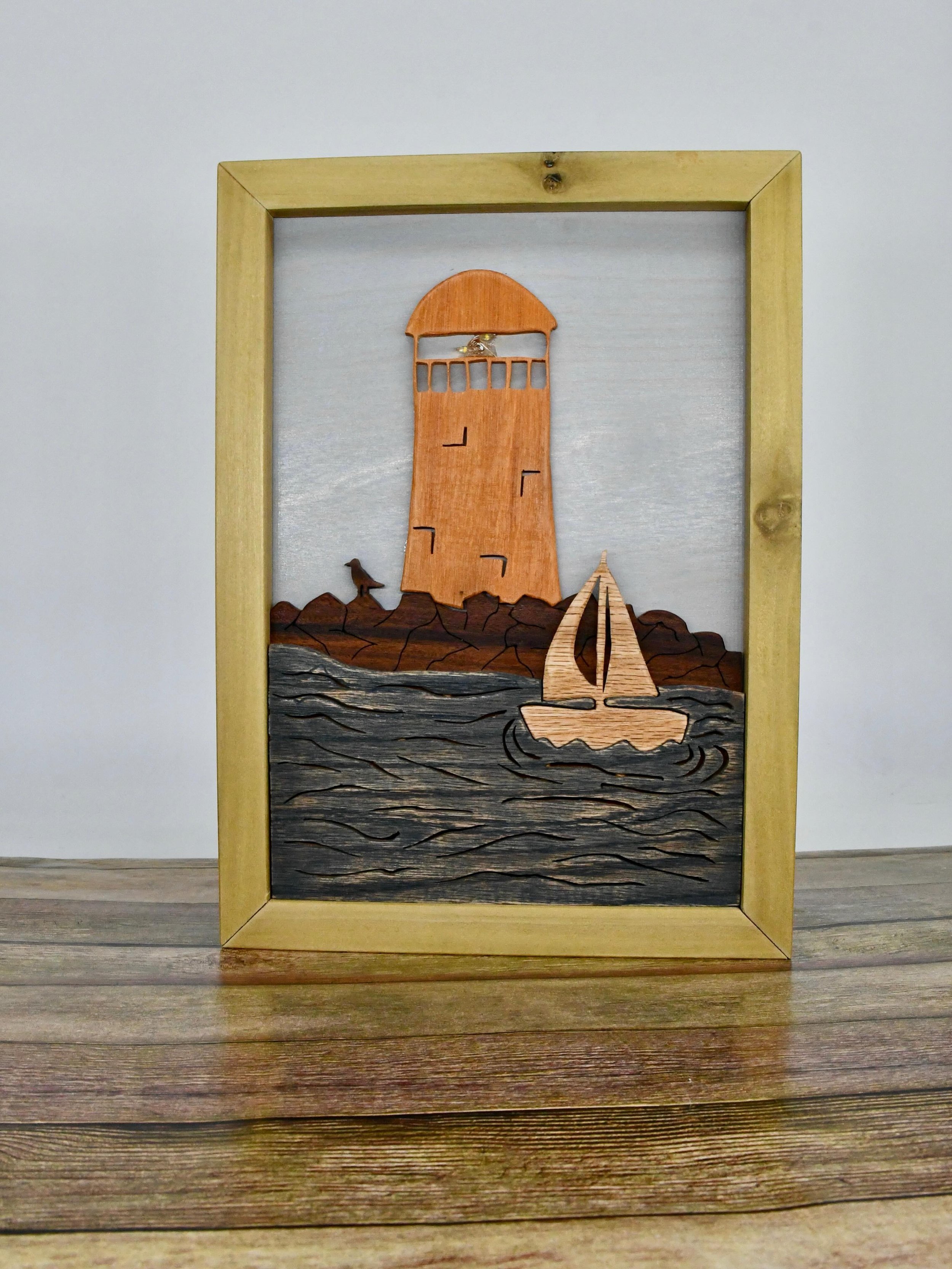 I think this might be my favorite scene I&rsquo;ve done! 
I love how the sailboat on the water turned out, and the light in the lighthouse adds so much to it!
Let me know which part is your favorite!

This is a perfect addition to a beach house, or f