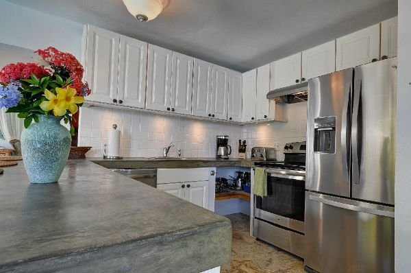 Fully equipped kitchen with stainless steel appliances.