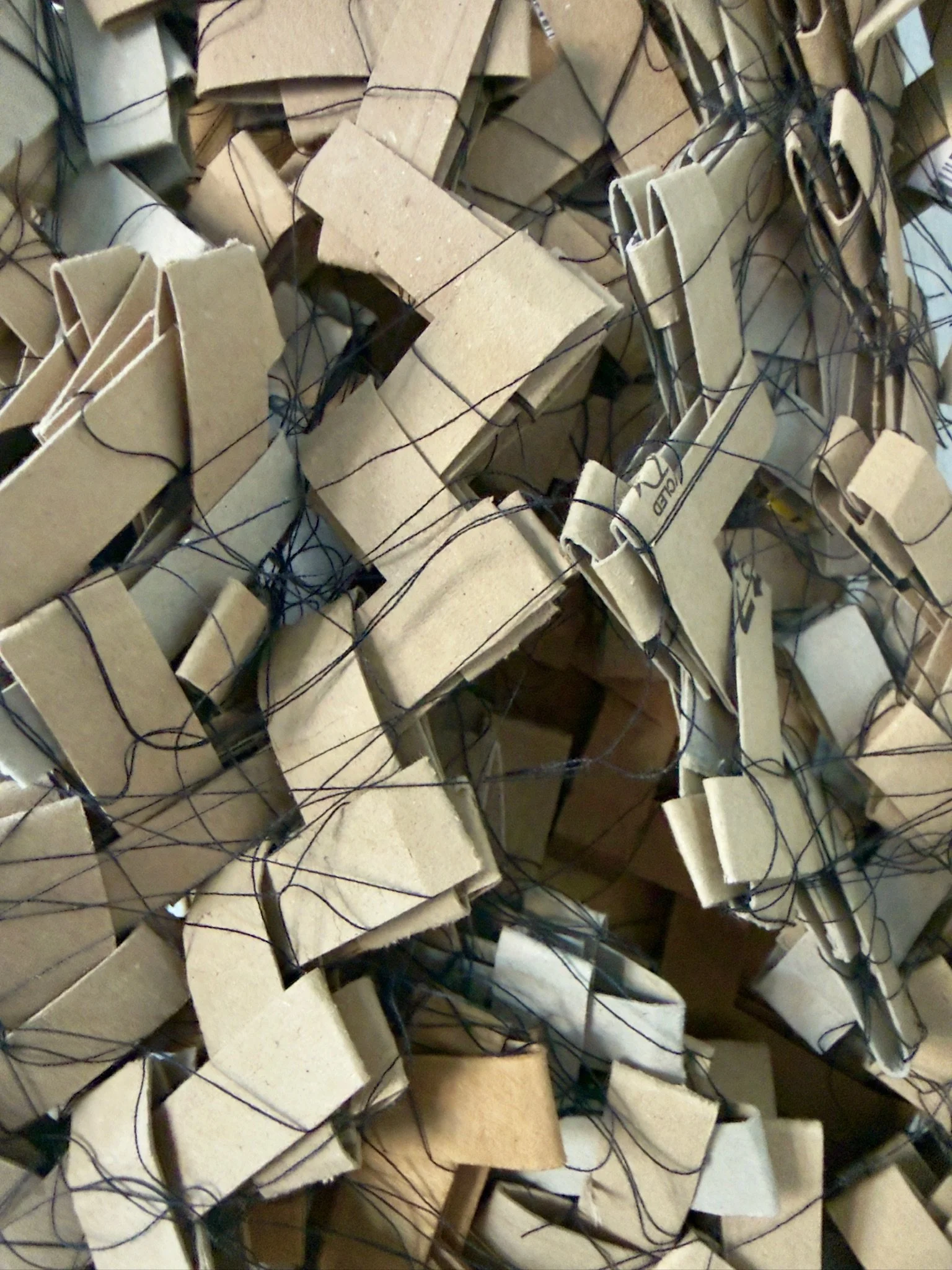 Track your Parcel (Detail) Nov 2025. Amazon Packaging, Thread and masking tape. Image: Richard Beach