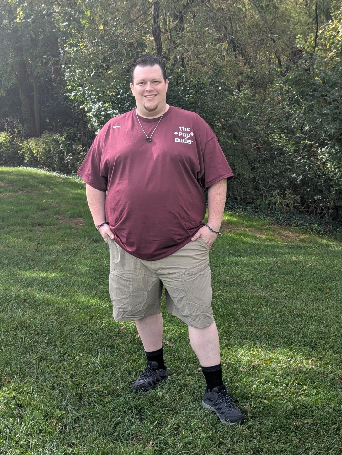 Derek, owner of The Pup Butler, standing in uniform outdoors in Batavia, Ohio.