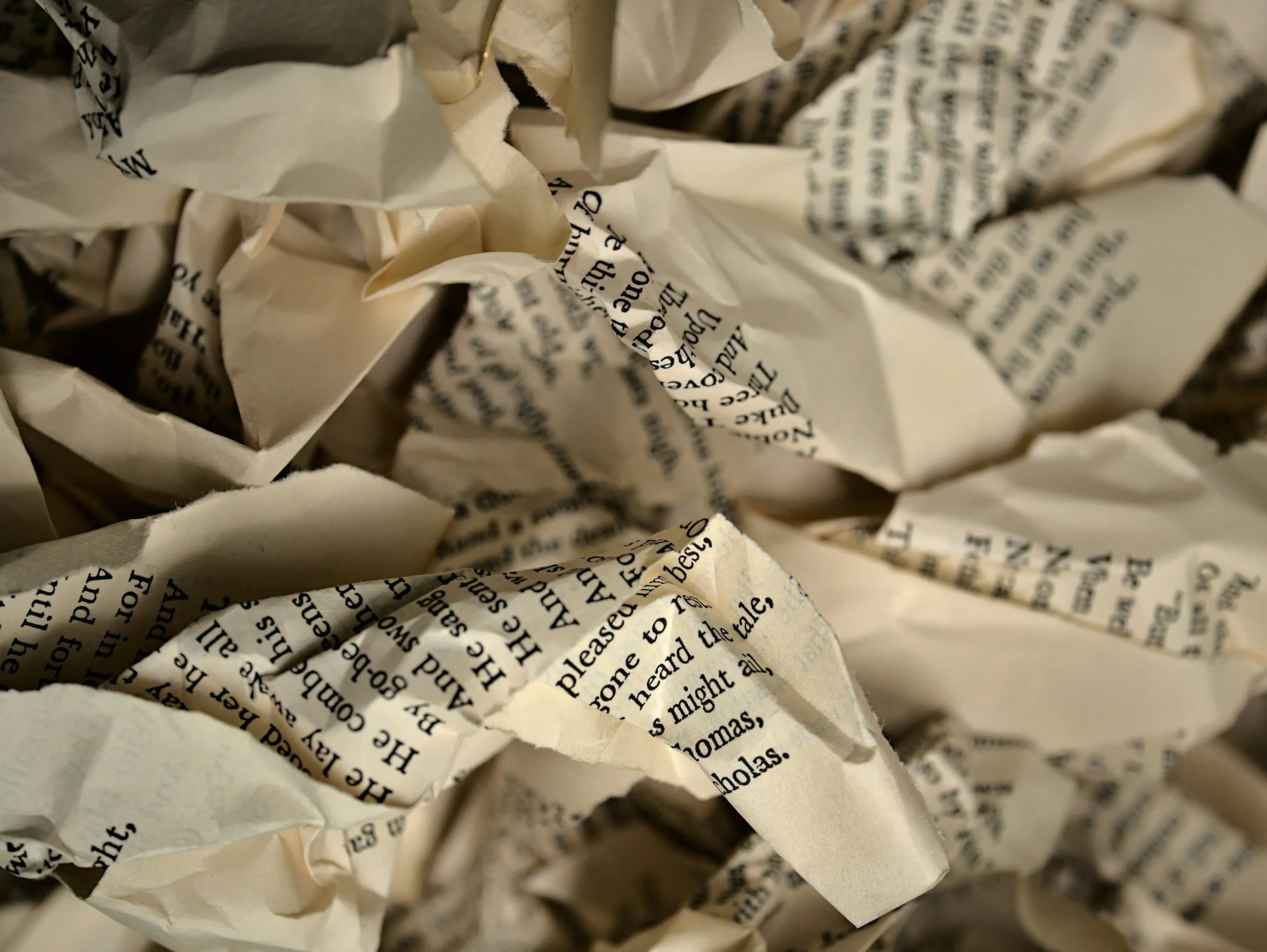 crumbled pages of a book representing censorship
