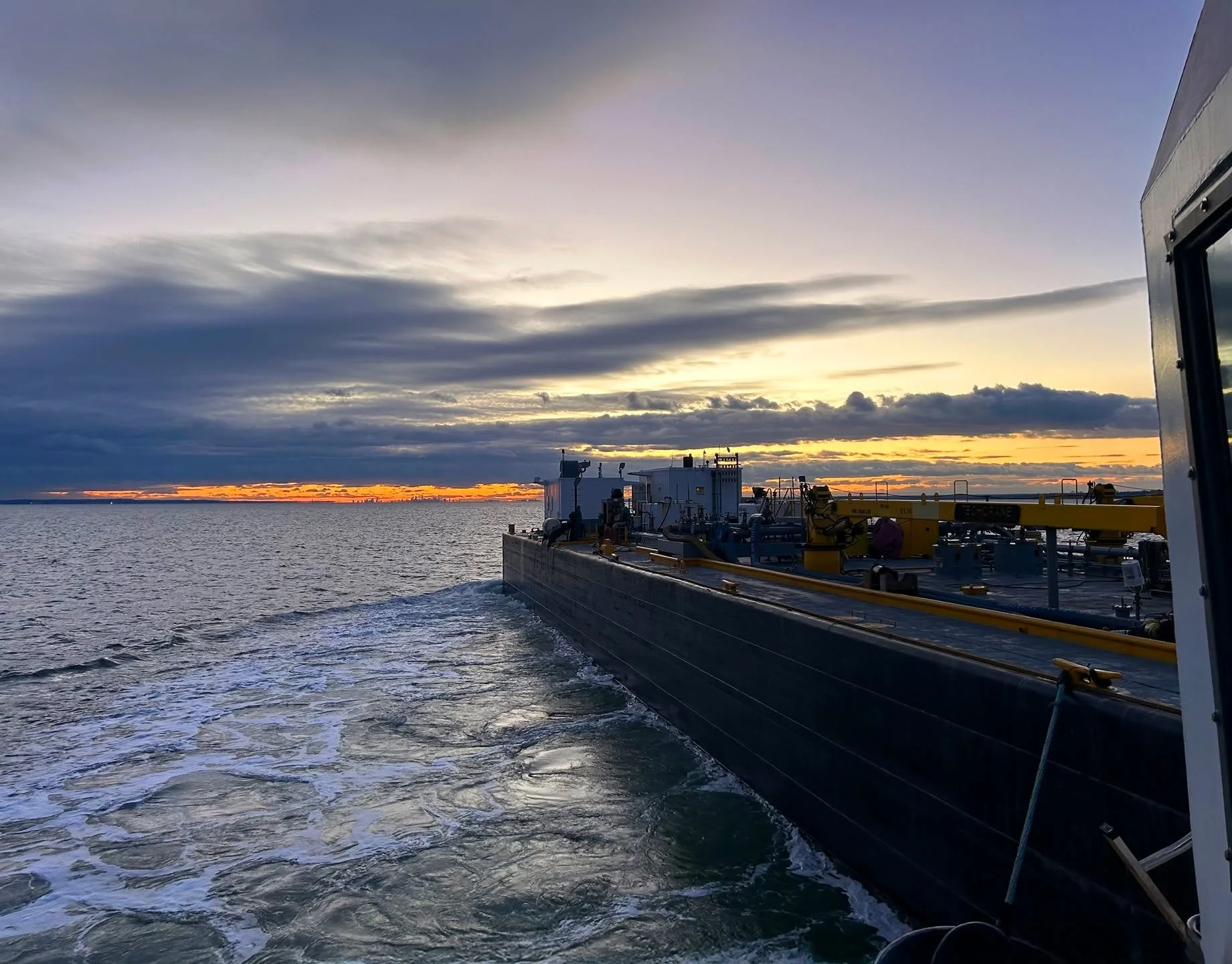Heading for the horizon in the vicinity of New Haven, CT, with the Vane Brothers tug FELLS POINT and barge Double Skin 38. [Photo by Stephen Spaulding] #TheVaneBrothersCompany #Tugboat #Barge #FellsPoint
