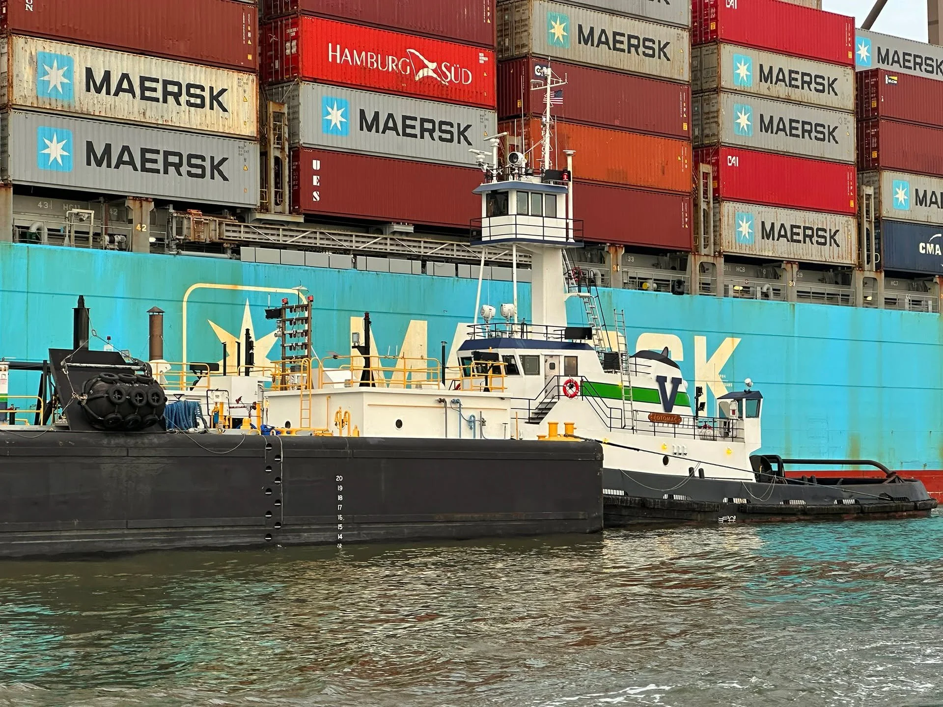 The 4,200-hp tug POTOMAC, currently operating for Vane Brothers in the Philly area, moves a bunkering barge alongside a container ship. [Photo by William White] #TheVaneBrothersCompany #Tugboat #Barge #Potomac
