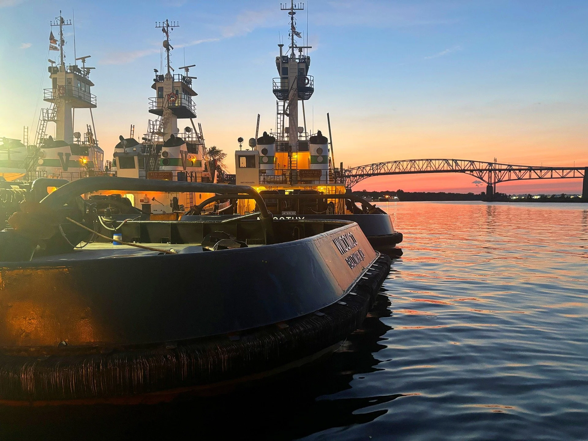 On the Schuylkill River in Philly, a lineup of Vane Brothers tugs prepares for a new day (with the stern of the tug WICOMICO appearing in the foreground). [Photo by Melissa Lucante] #TheVaneBrothersCompany #Tugboats #Wicomico #SchuylkillRiver